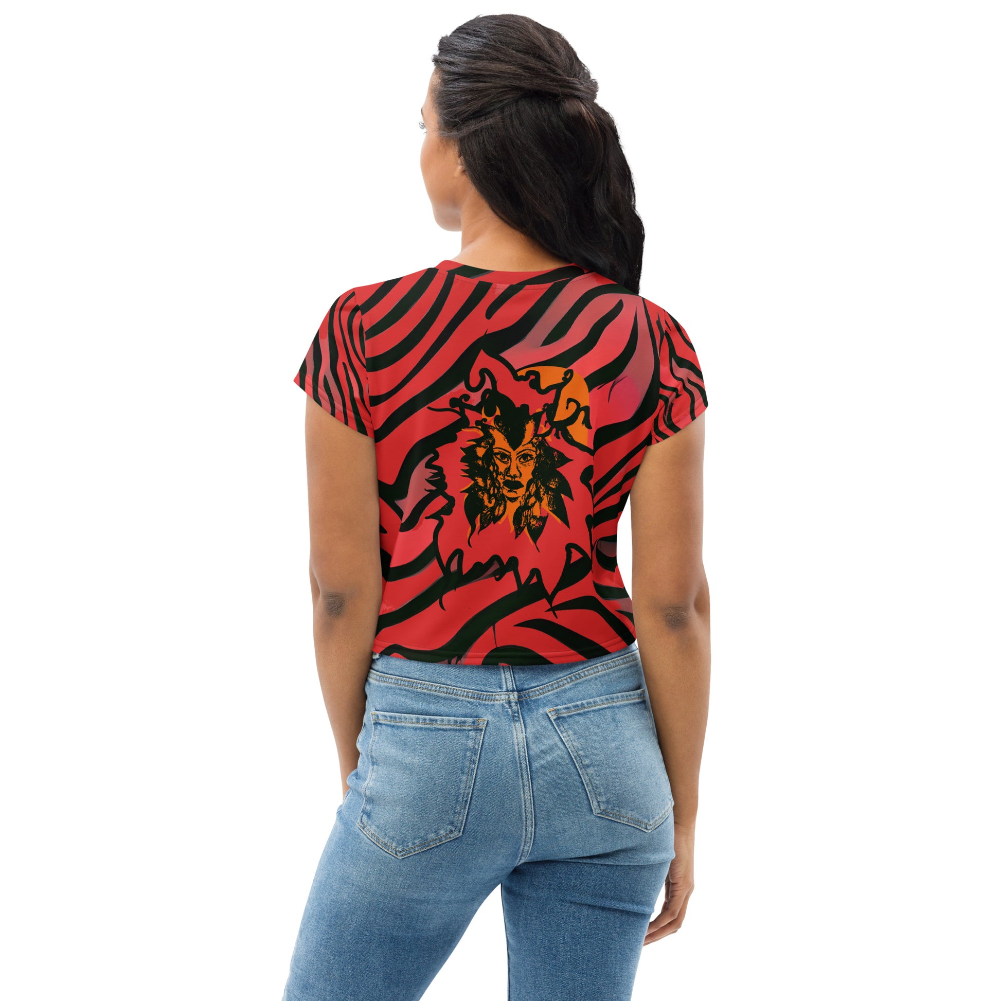 A model wearing bold red and black crop tee from Kloe Store featuring a striking artistic face design and abstract swirling patterns, showcasing trendy and edgy streetwear fashion, back view.