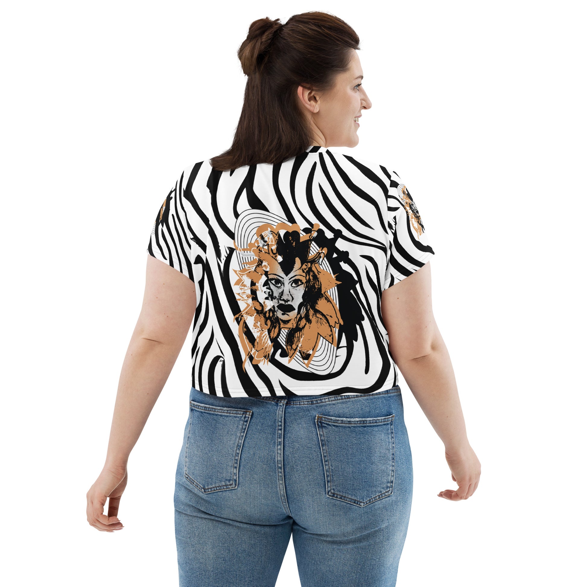 Plus size model wearing black and white zebra print crop tee from Kloe Store featuring a bold artistic face design in the center, showcasing unique and edgy streetwear fashion, back view.