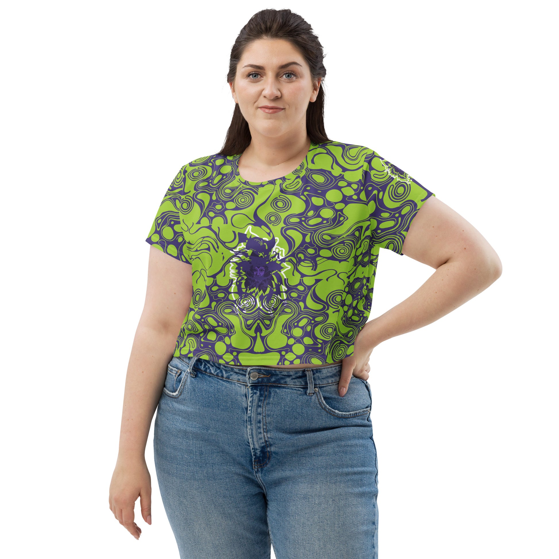 A model wearing green and purple crop tee from Kloe Store featuring bold abstract patterns and a unique central artistic face design, perfect for a trendy and edgy streetwear style.
