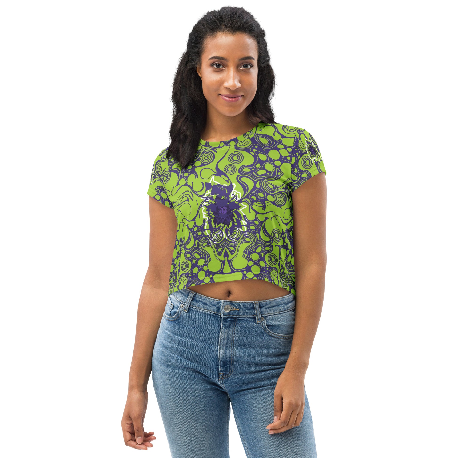A model wearing green and purple crop tee from Kloe Store featuring bold abstract patterns and a unique central artistic face design, perfect for a trendy and edgy streetwear style.
