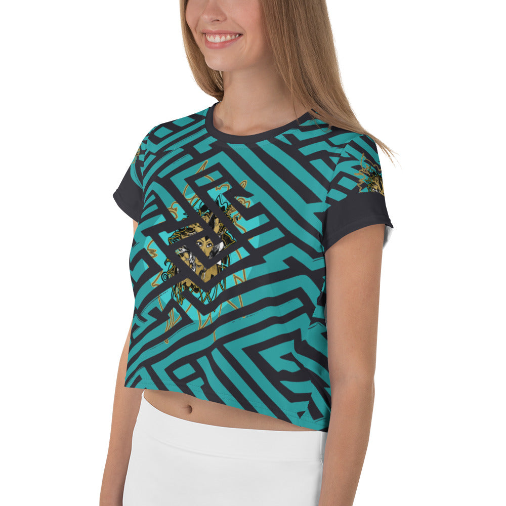 Front view of a vibrant blue and black geometric patterned crop top with a bold graphic centerpiece, perfect for streetwear fashion.