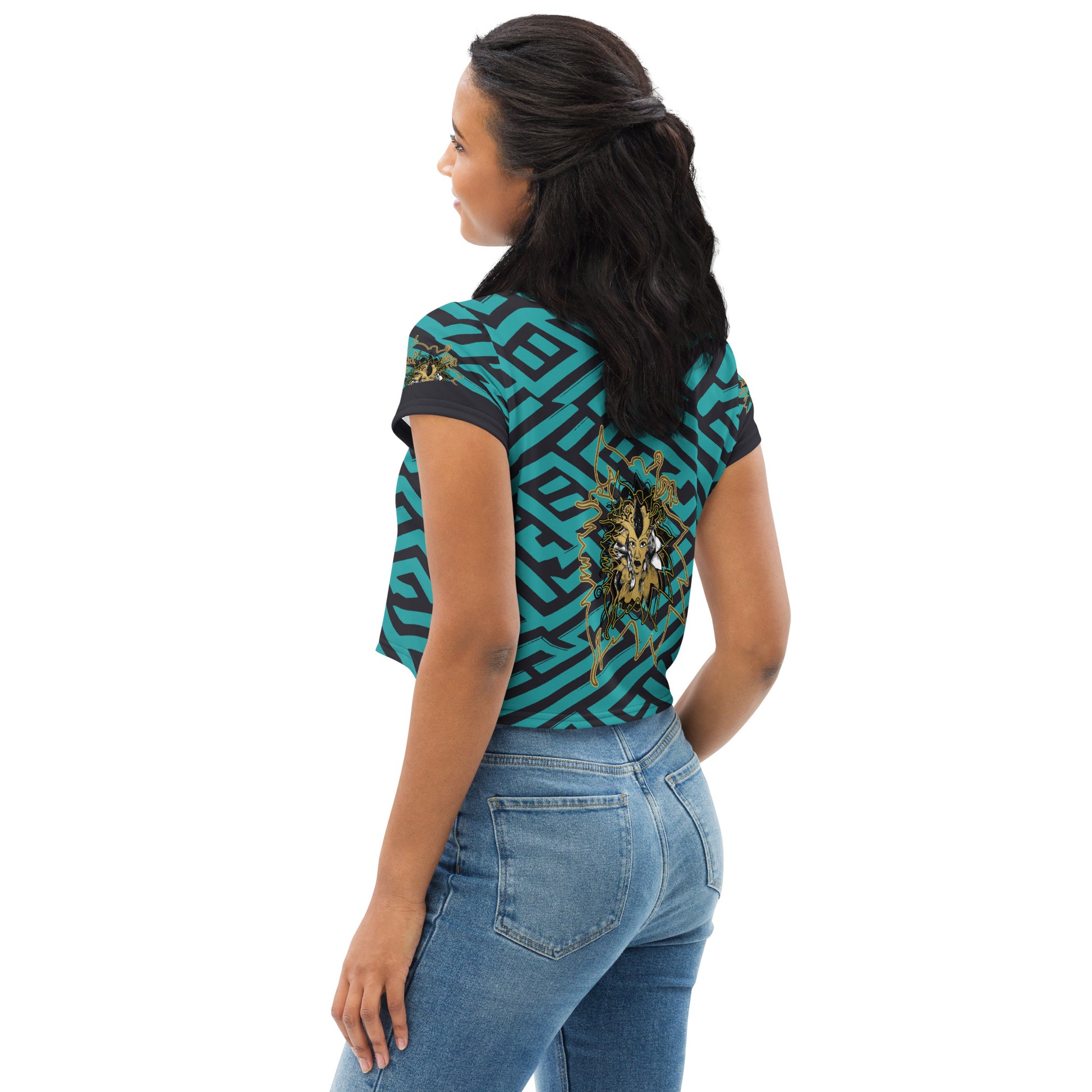 Back view of a vibrant blue and black geometric patterned crop top with a bold graphic centerpiece, perfect for streetwear fashion.