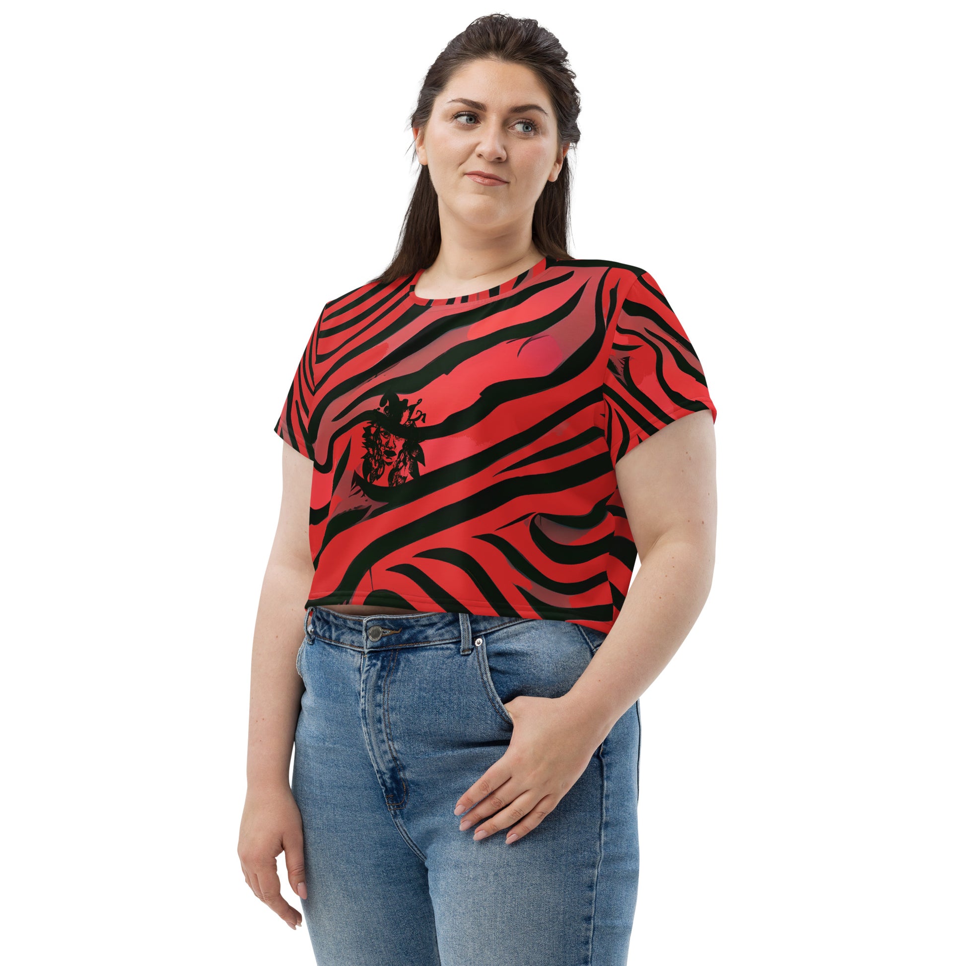 A model wearing bold red and black crop tee from Kloe Store featuring a striking artistic face design and abstract swirling patterns, showcasing trendy and edgy streetwear fashion.