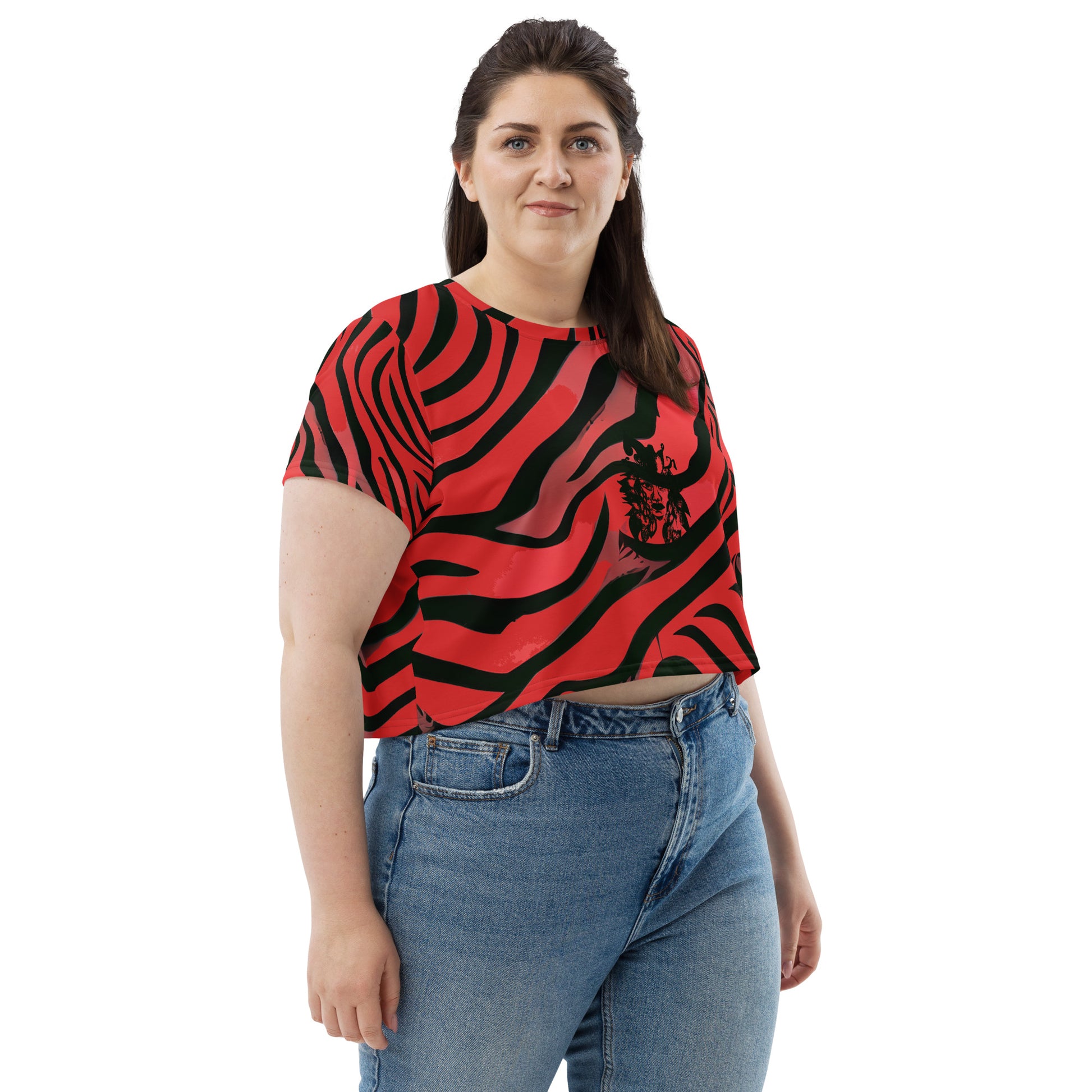 A model wearing bold red and black crop tee from Kloe Store featuring a striking artistic face design and abstract swirling patterns, showcasing trendy and edgy streetwear fashion."
