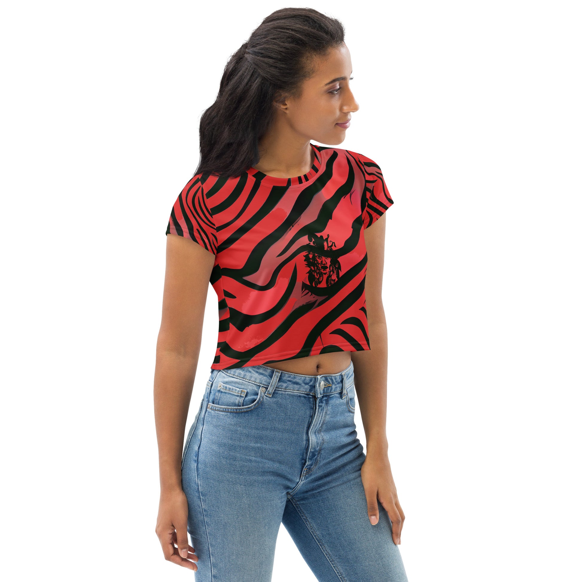 A model wearing bold red and black crop tee from Kloe Store featuring a striking artistic face design and abstract swirling patterns, showcasing trendy and edgy streetwear fashion.
