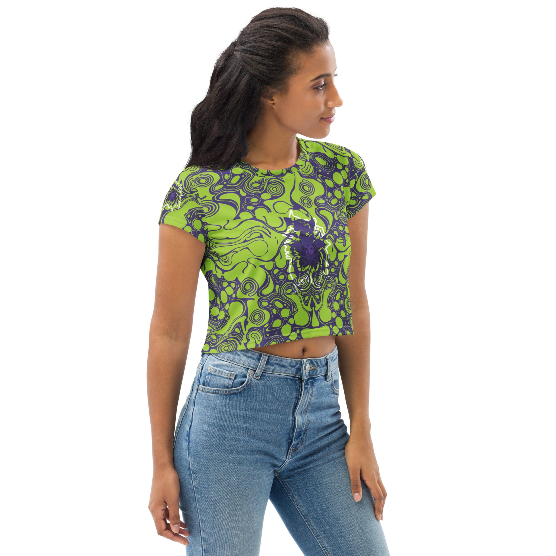 A model wearing green and purple crop tee from Kloe Store featuring bold abstract patterns and a unique central artistic face design, perfect for a trendy and edgy streetwear style.