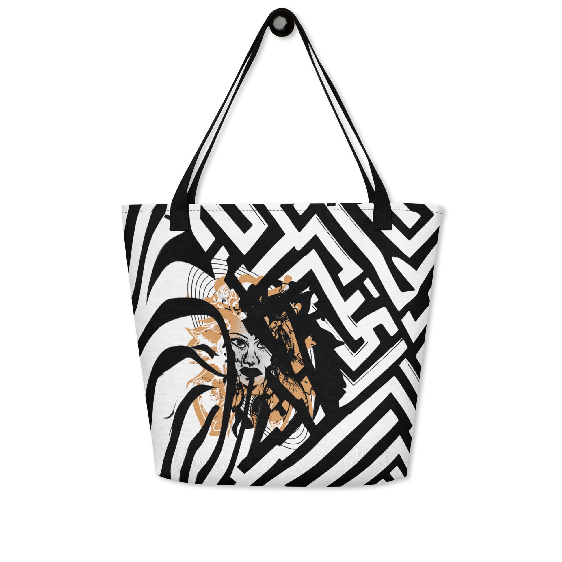 Large black and white tote bag from Kloe Store featuring bold geometric and zebra patterns with an artistic face design and with black straps, stylish and functional for everyday use.