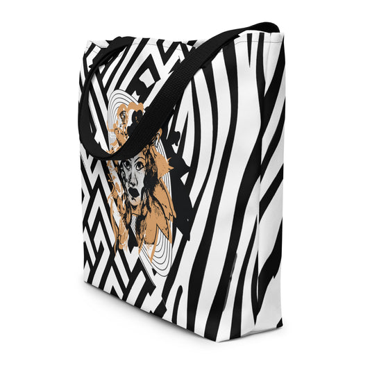 Large black and white tote bag from Kloe Store featuring bold geometric and zebra patterns with an artistic face design and with black straps, stylish and functional for everyday use.