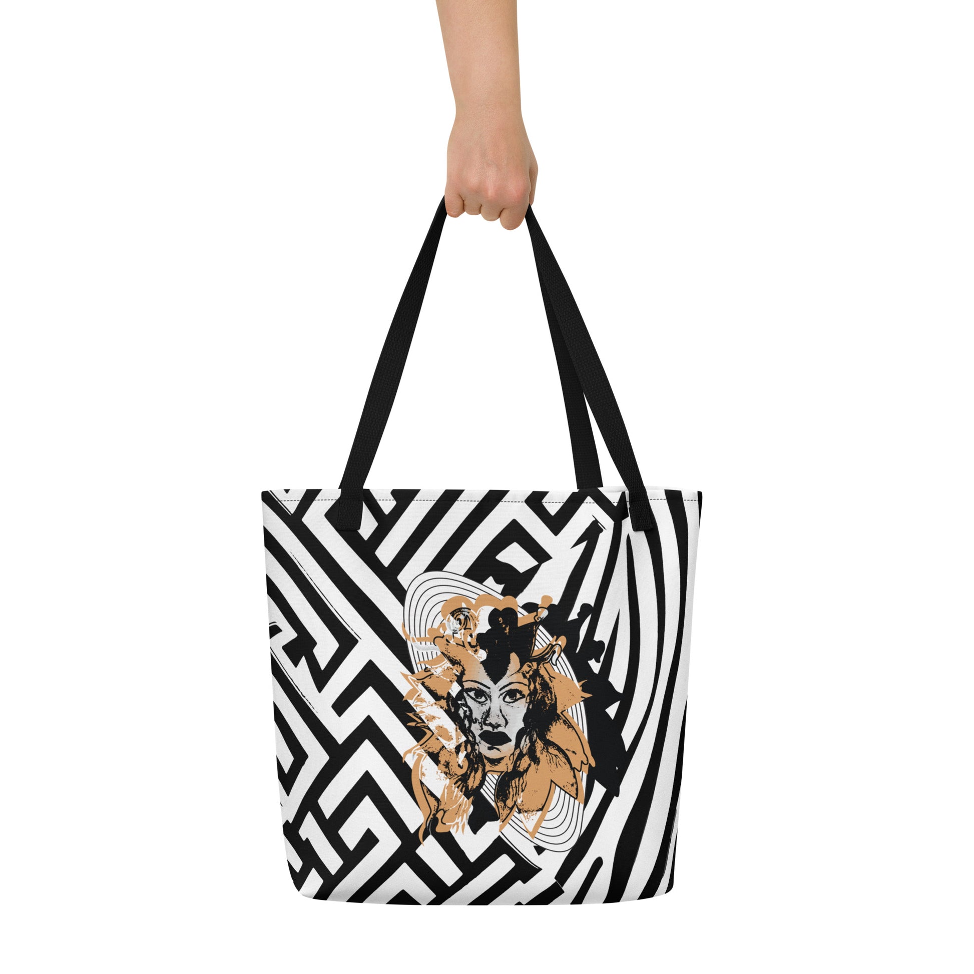 Large black and white tote bag from Kloe Store featuring bold geometric and zebra patterns with an artistic face design and with black straps, stylish and functional for everyday use.