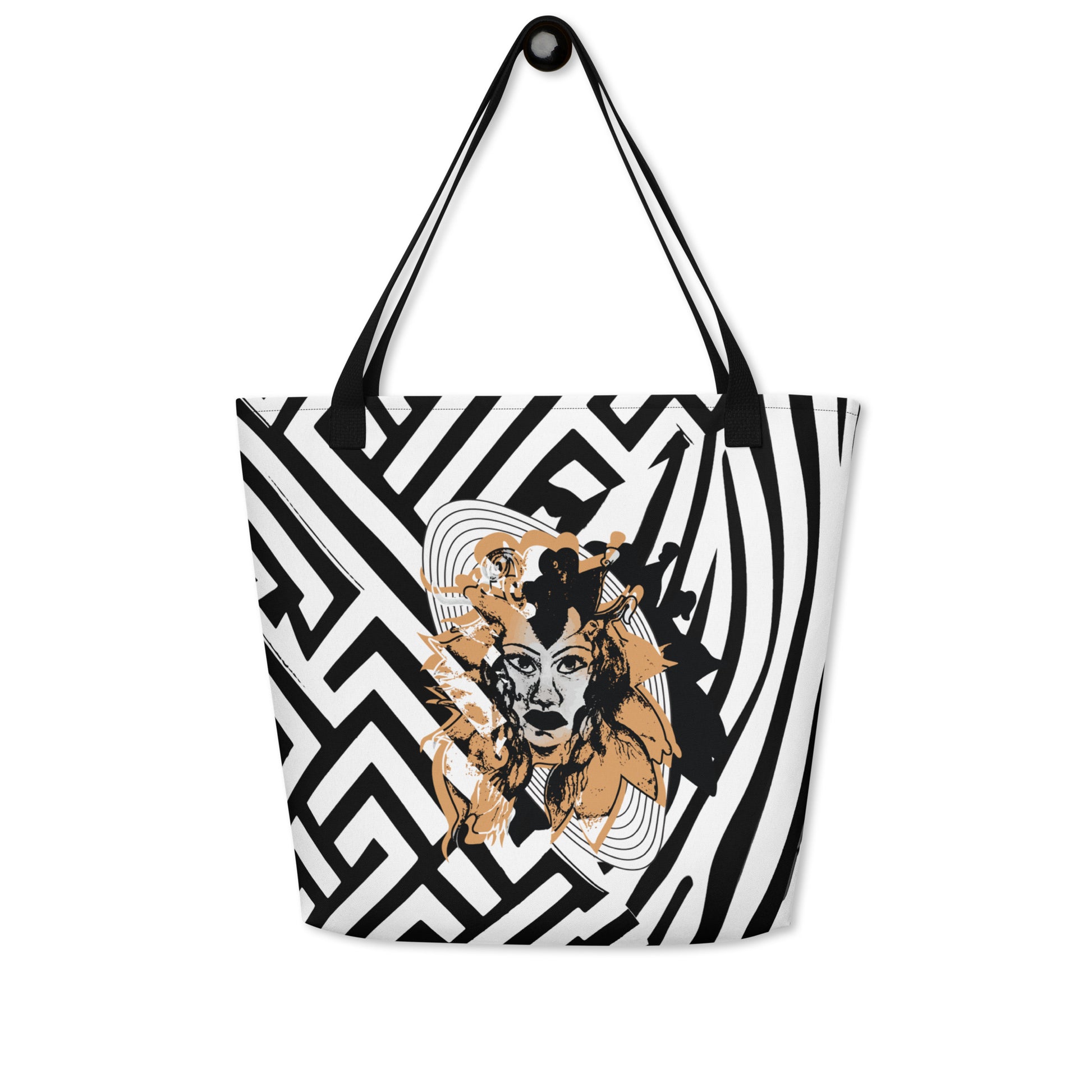 Large black and white tote bag from Kloe Store featuring bold geometric and zebra patterns with an artistic face design and with black straps, stylish and functional for everyday use.