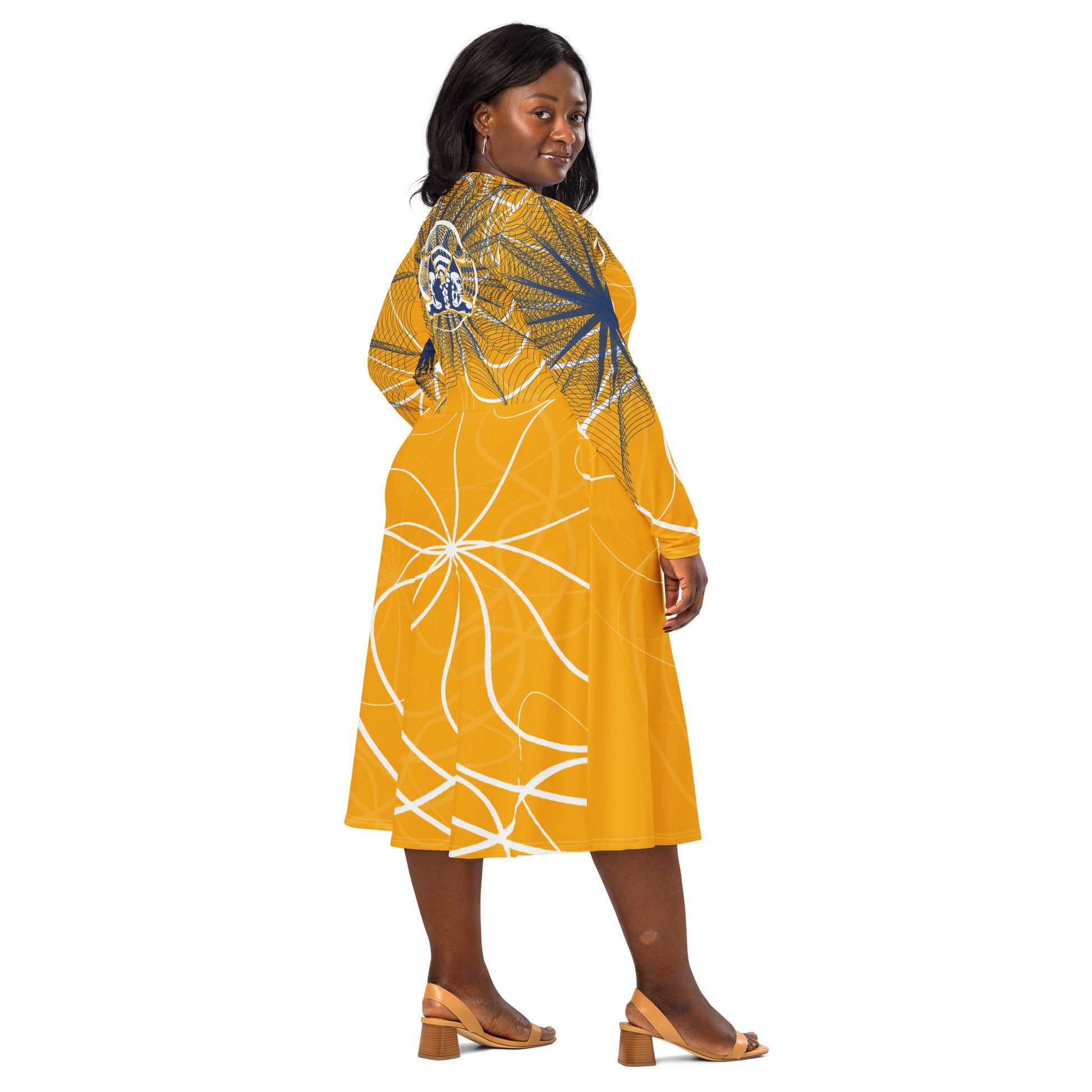 Back view of a golden yellow midi dress with navy web-style graphics and a mirrored face emblem across the upper back, combining cultural artistry with modern silhouette from the Secret Chambers of I and I collection.