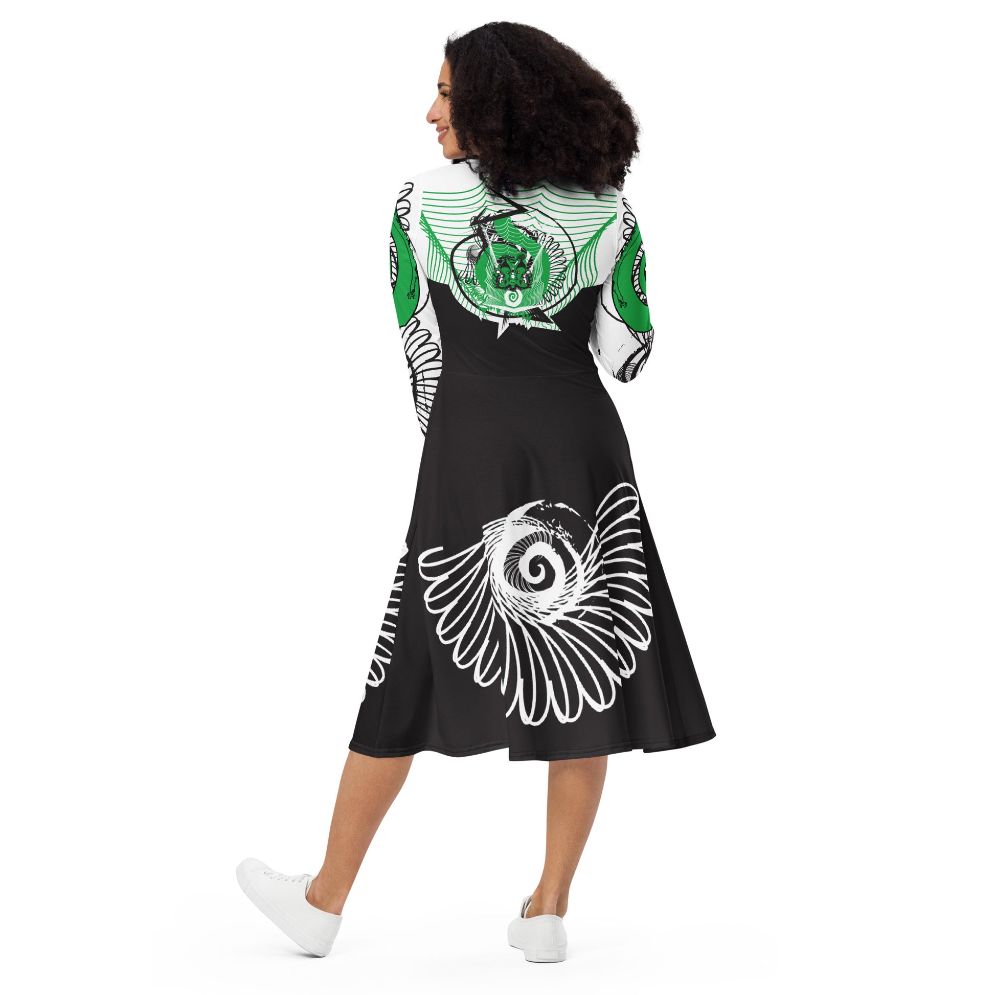 Hand-illustrated long-sleeve midi dress featuring bold green spirals, a drawing of two mirrored faces, and dynamic wing-inspired linework — designed for authentic self-expression and rooted in global artistic influence, exclusive to KLOE.