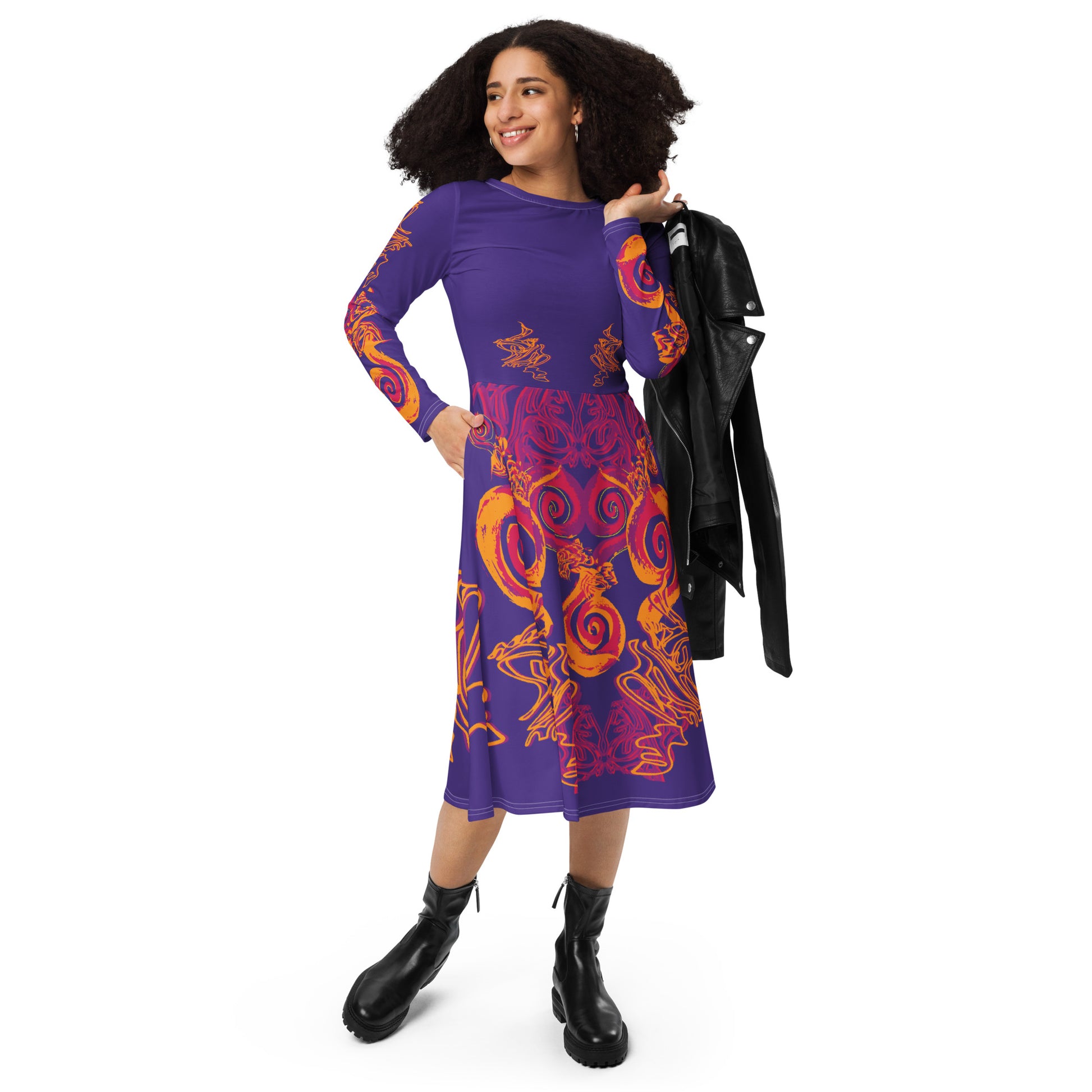 Bold purple long sleeve dress with vibrant orange and red culturally inspired patterns, featuring mirrored face design and swirling motifs — expressive fashion from KLOE’s The Secret Chambers of I & I collection, on a model.
