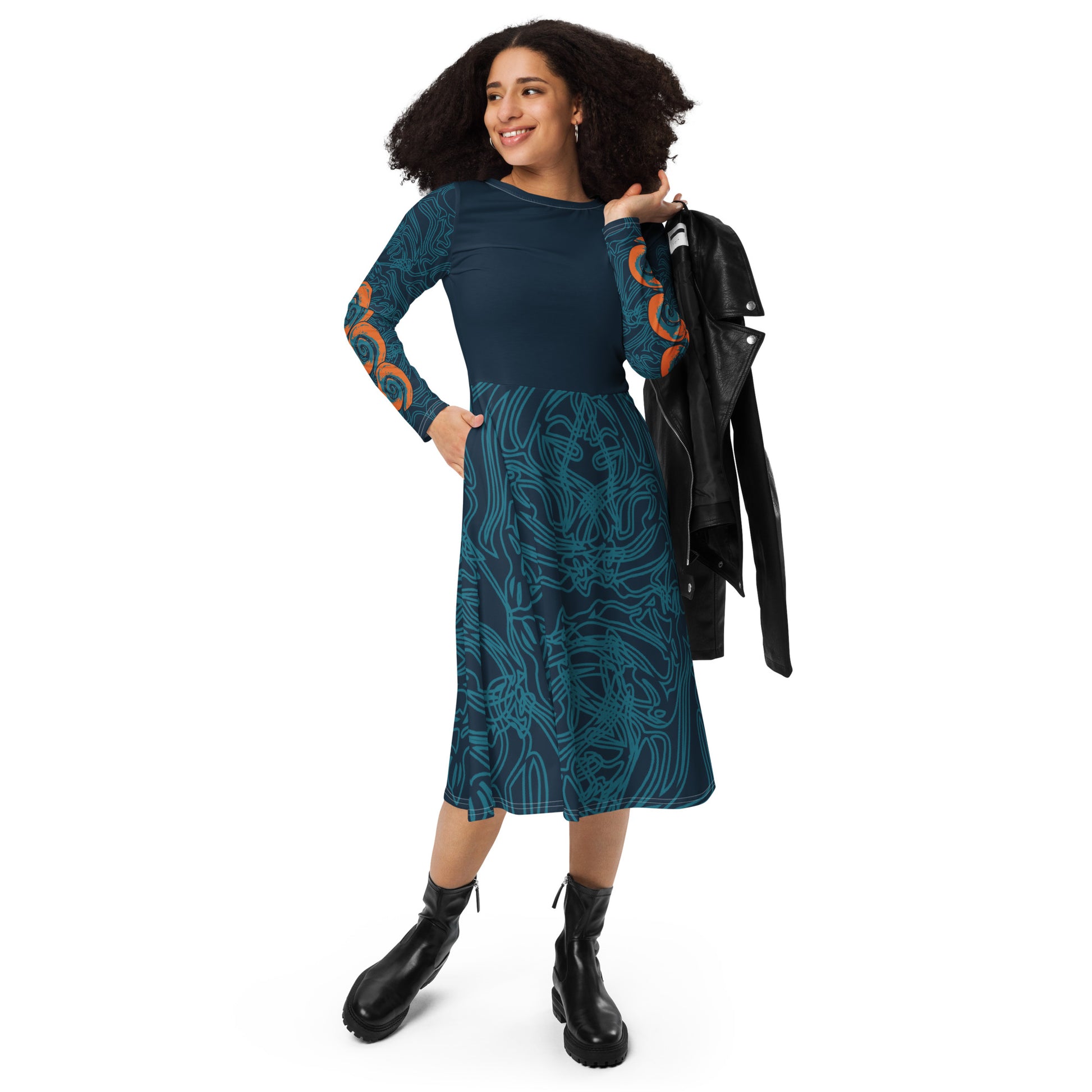 Front view of a navy blue long-sleeve dress with swirling cyan line art, bold orange sleeve accents, and a fit-and-flare design, on a model. 