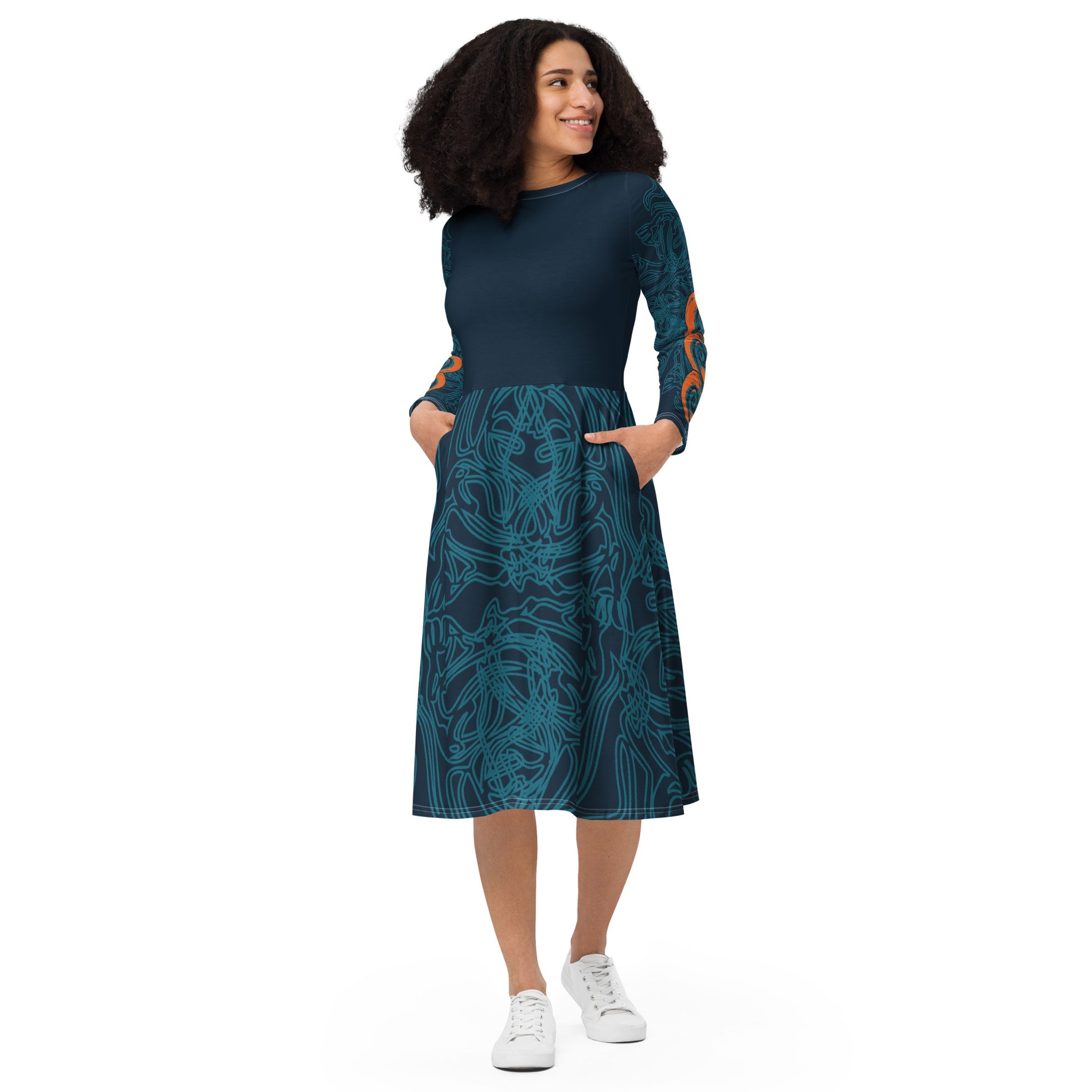 Front view of a navy blue long-sleeve dress with swirling cyan line art, bold orange sleeve accents, and a fit-and-flare design, on a model.