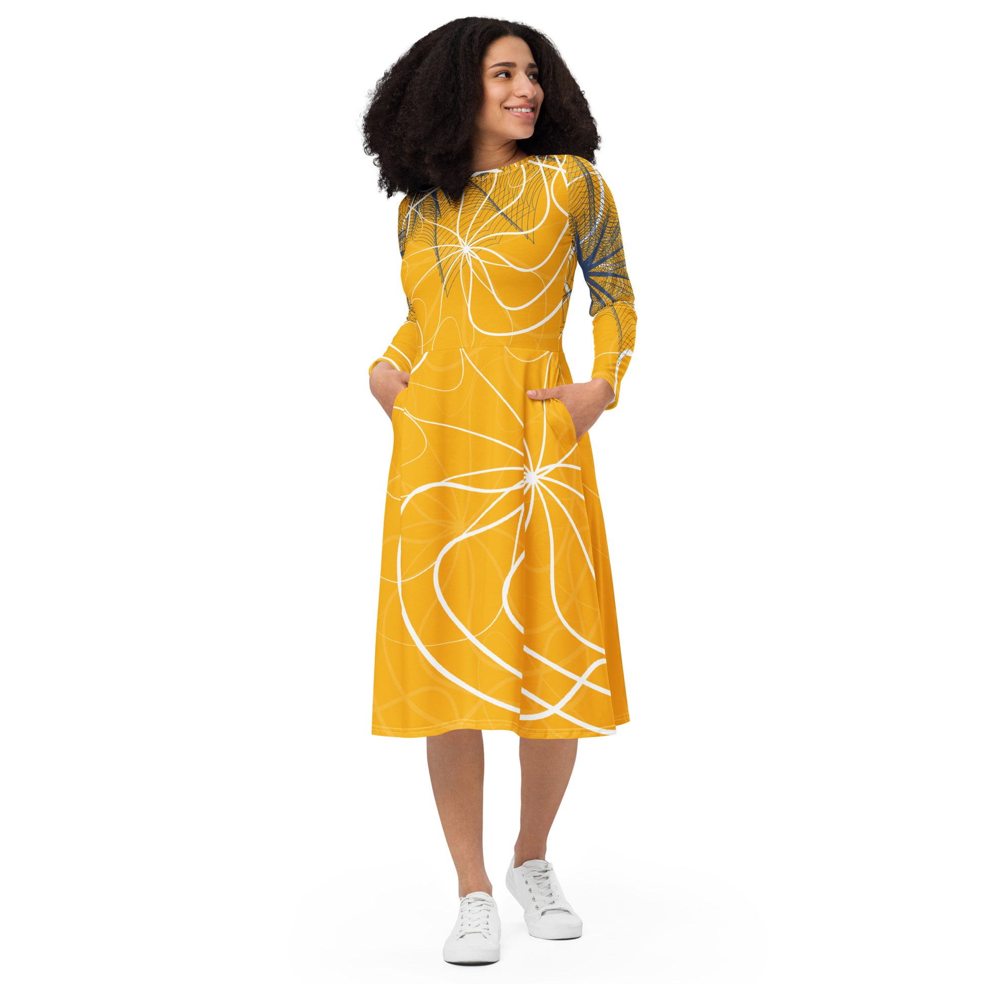 Front view of a golden yellow long sleeve midi dress featuring white swirling line art and navy geometric accents, blending flowing streetwear design with expressive hand-drawn patterns.