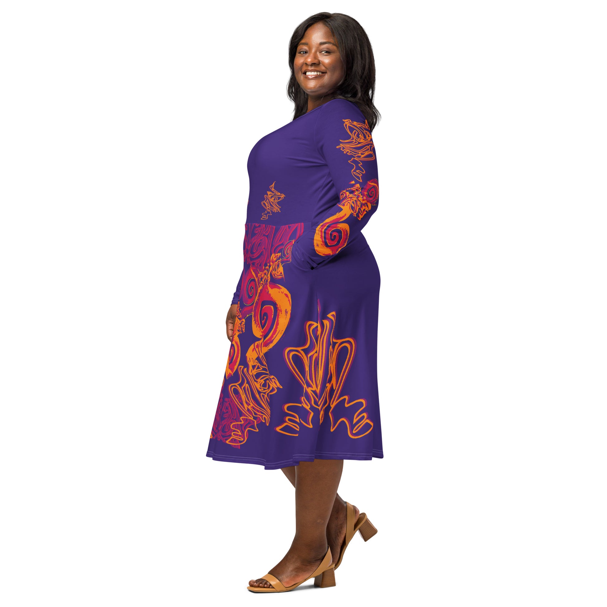 Bold purple long sleeve dress with vibrant orange and red culturally inspired patterns, featuring mirrored face design and swirling motifs — expressive fashion from KLOE’s The Secret Chambers of I & I collection, on a model.