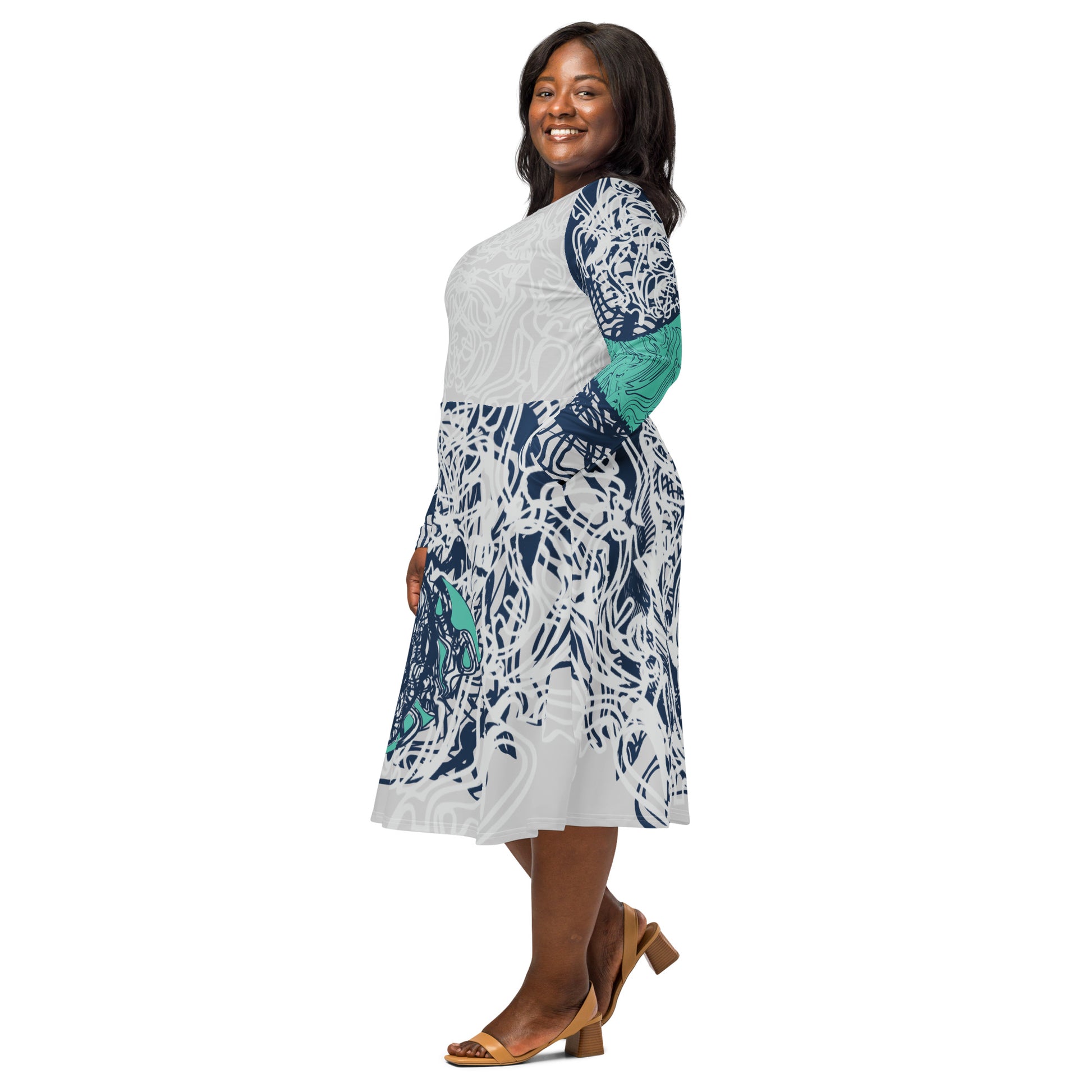 Long sleeve midi dress with full-body abstract print in navy and jade, featuring hand-drawn mirrored faces and layered spiral motifs—designed to express standout individuality.