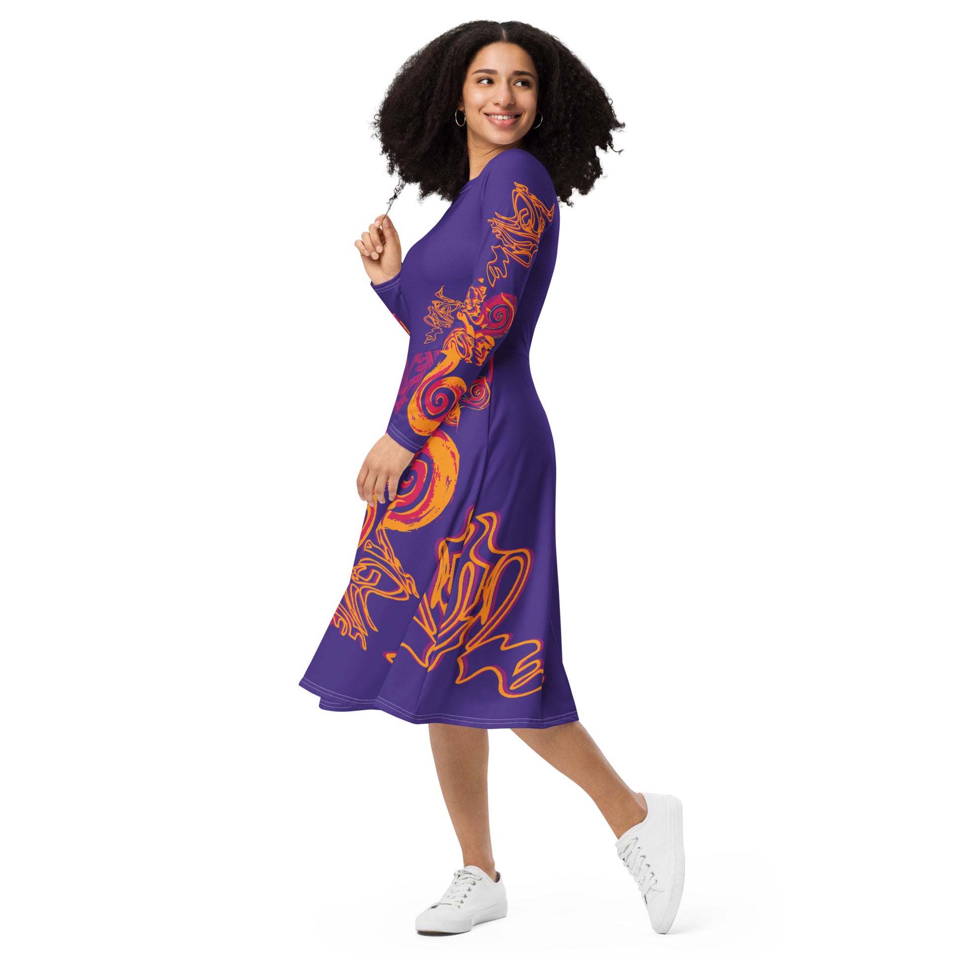 Bold purple long sleeve dress with vibrant orange and red culturally inspired patterns, featuring mirrored face design and swirling motifs — expressive fashion from KLOE’s The Secret Chambers of I & I collection, on a model.Bold purple long sleeve dress with vibrant orange and red culturally inspired patterns, featuring mirrored face design and swirling motifs — expressive fashion from KLOE’s The Secret Chambers of I & I collection, on a model.
