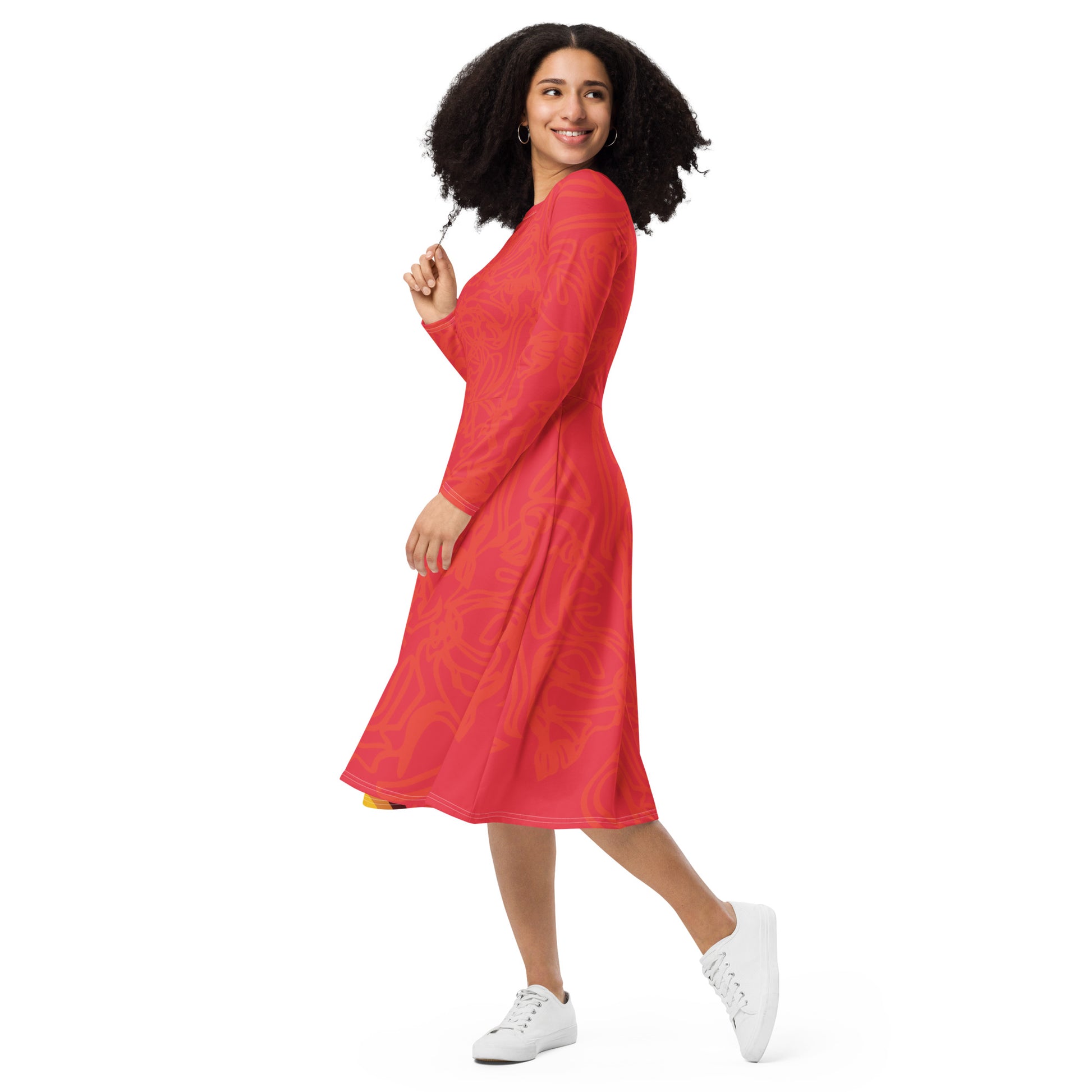 Red dress with vibrant swirl  details and mirrored face design on the back, inspired by cultural art and bold self-expression.