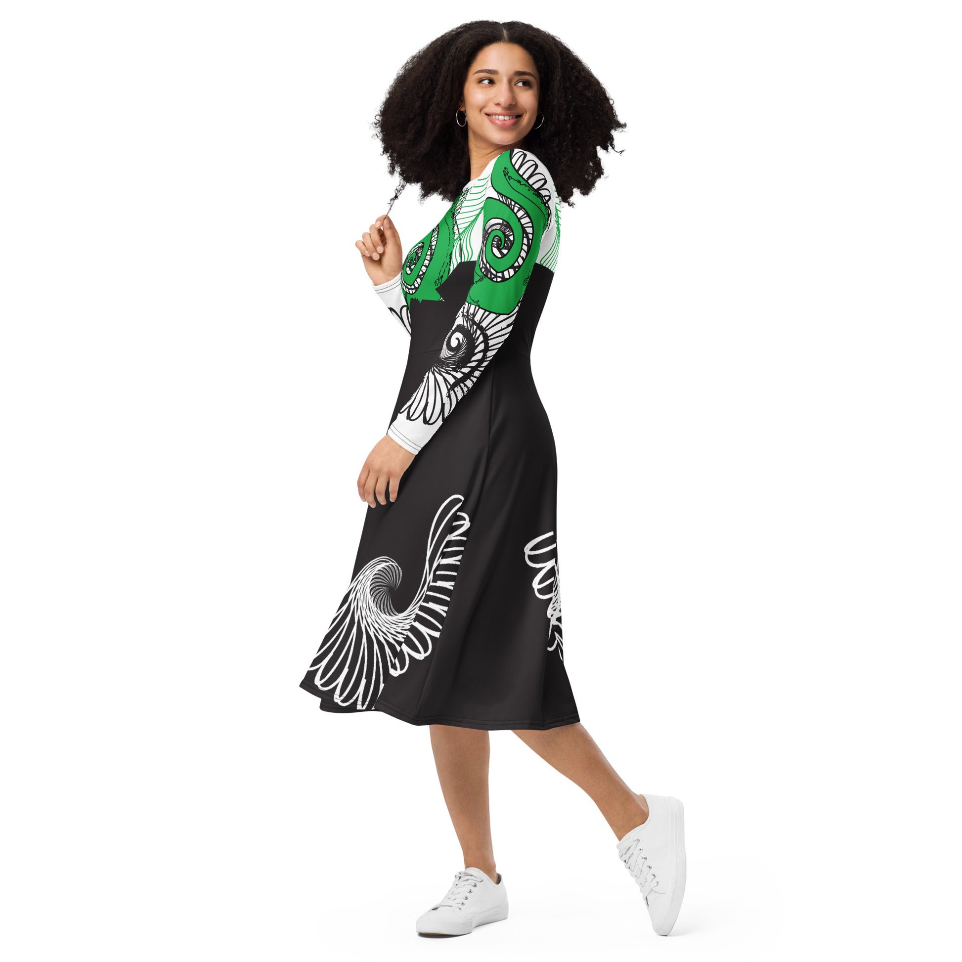 Hand-illustrated long-sleeve midi dress featuring bold green spirals, a drawing of two mirrored faces, and dynamic wing-inspired linework — designed for authentic self-expression and rooted in global artistic influence, exclusive to KLOE.