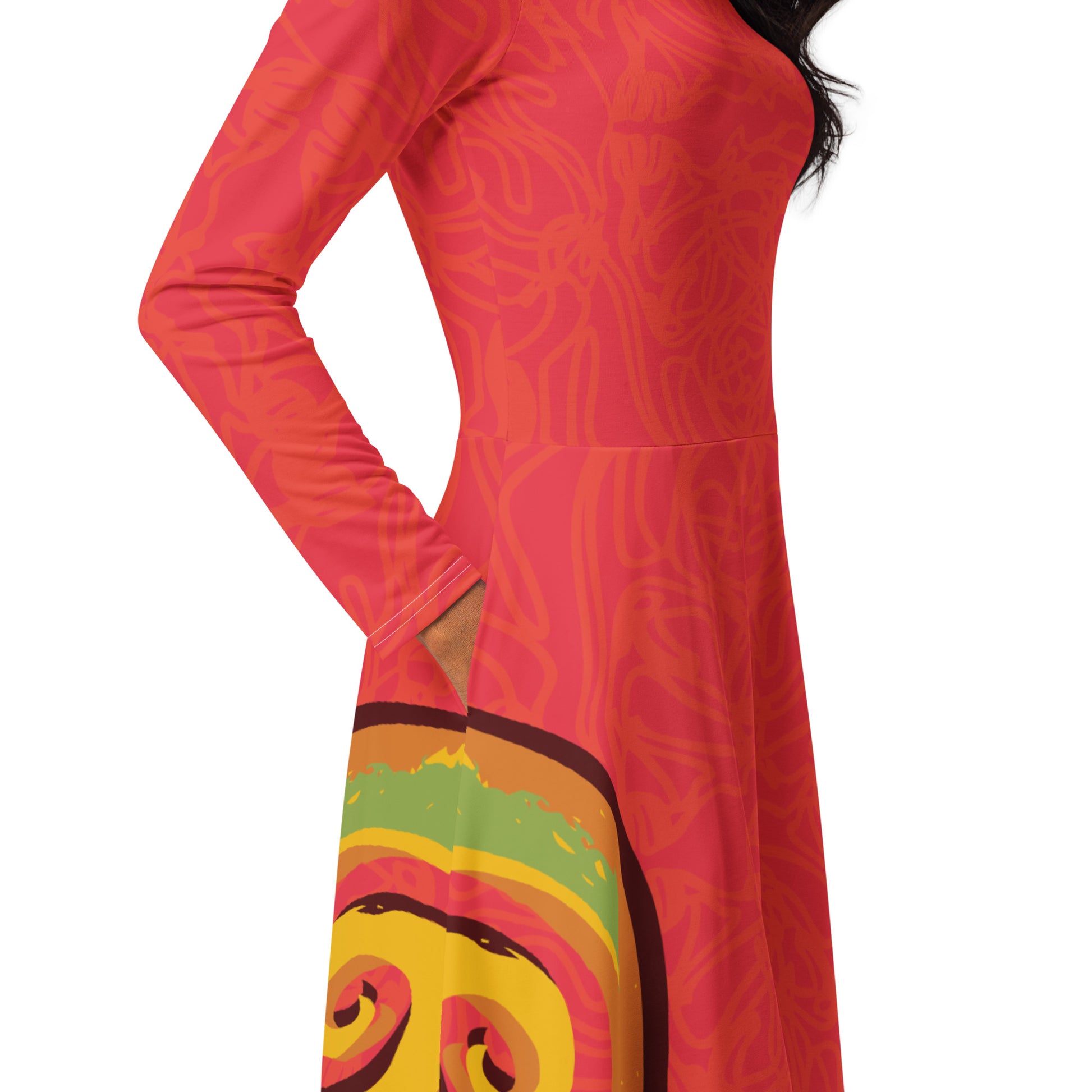 Red dress with vibrant swirl  details and mirrored face design on the back, inspired by cultural art and bold self-expression.