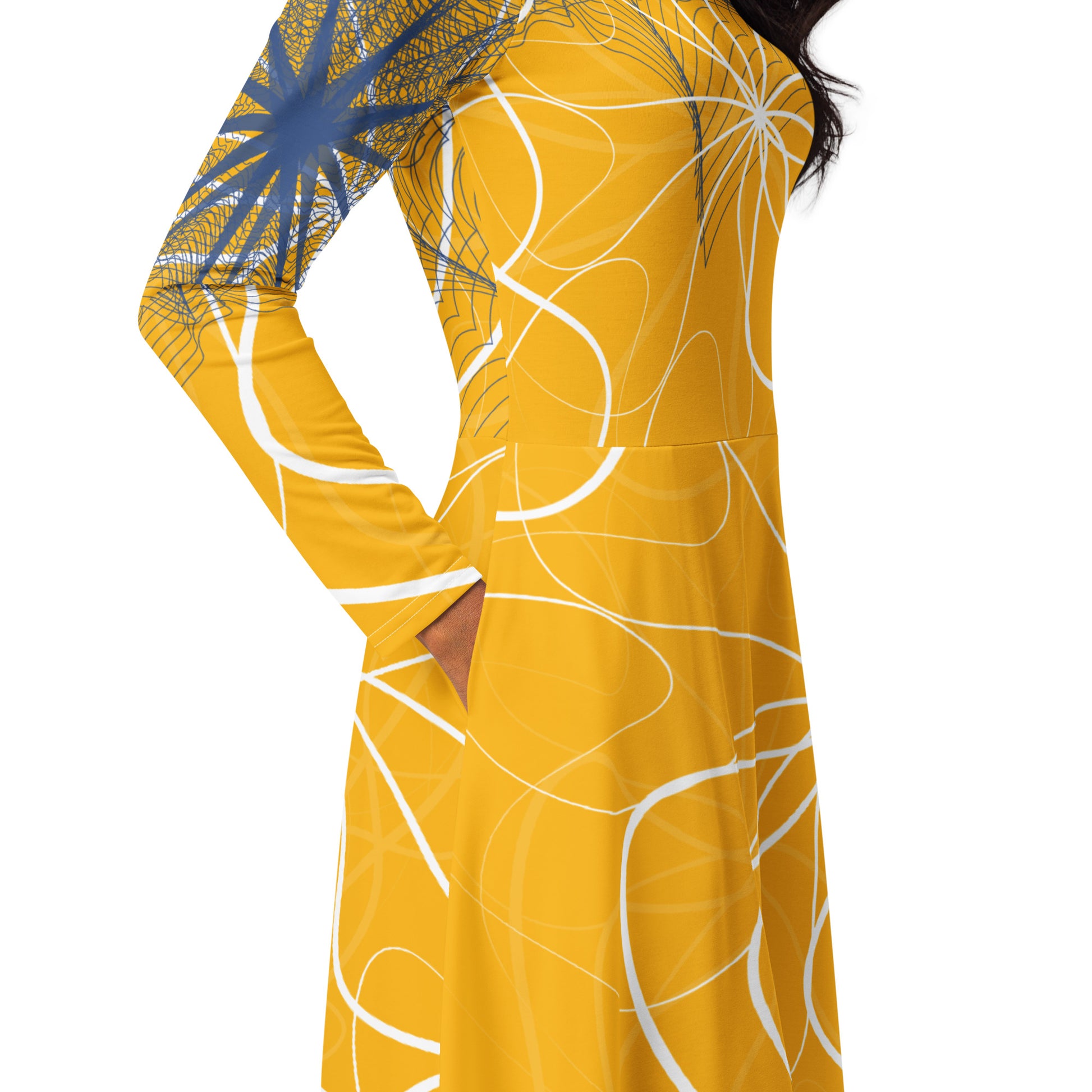 Front view of a golden yellow long sleeve midi dress featuring white swirling line art and navy geometric accents, blending flowing streetwear design with expressive hand-drawn patterns.