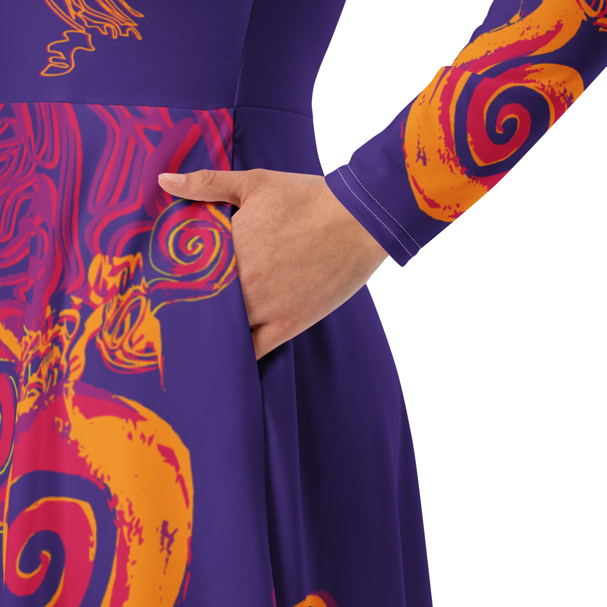 Bold purple long sleeve dress with vibrant orange and red culturally inspired patterns, featuring mirrored face design and swirling motifs — expressive fashion from KLOE’s The Secret Chambers of I & I collection, on a model, showing sleeve details.
