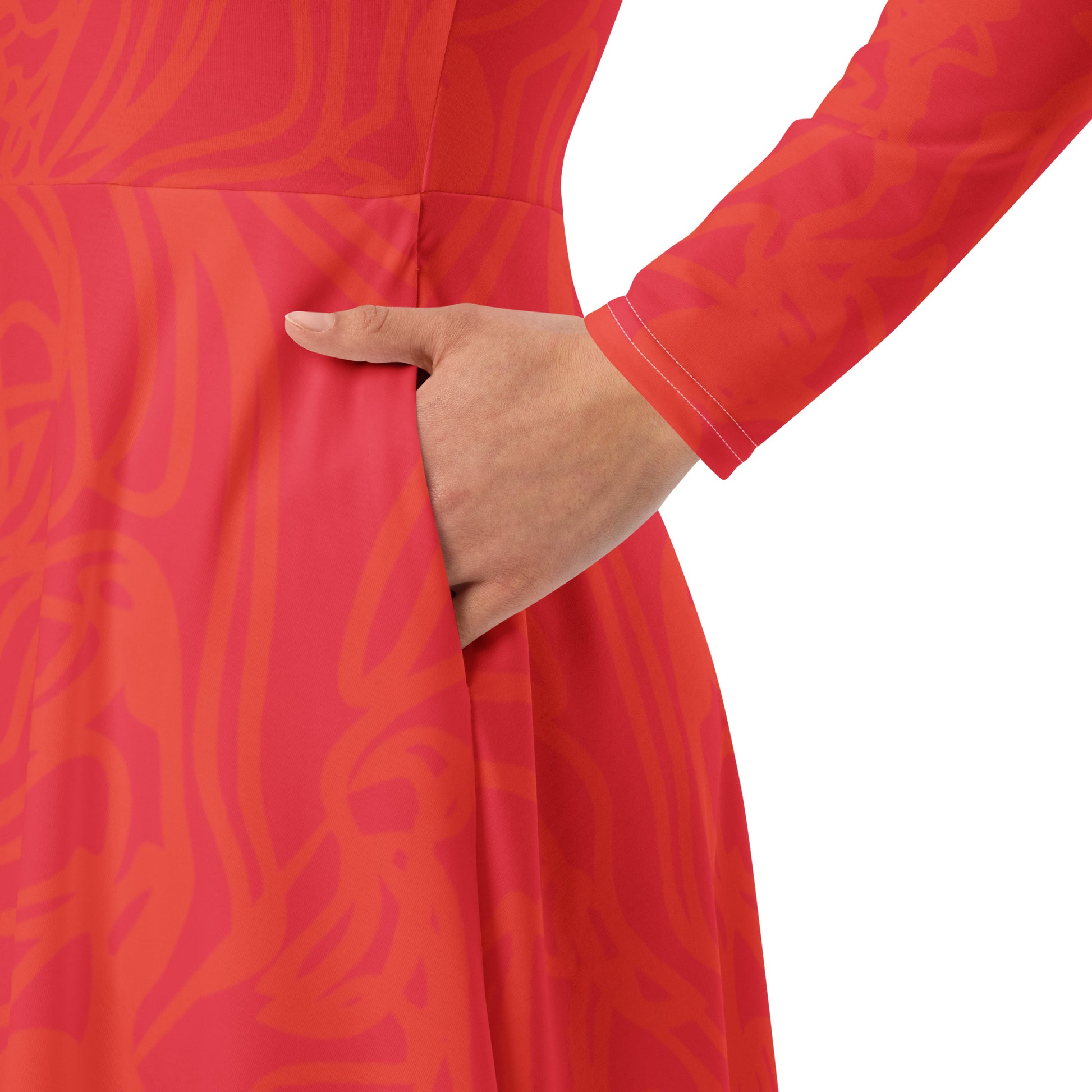 Red dress with vibrant swirl  details and mirrored face design on the back, inspired by cultural art and bold self-expression.