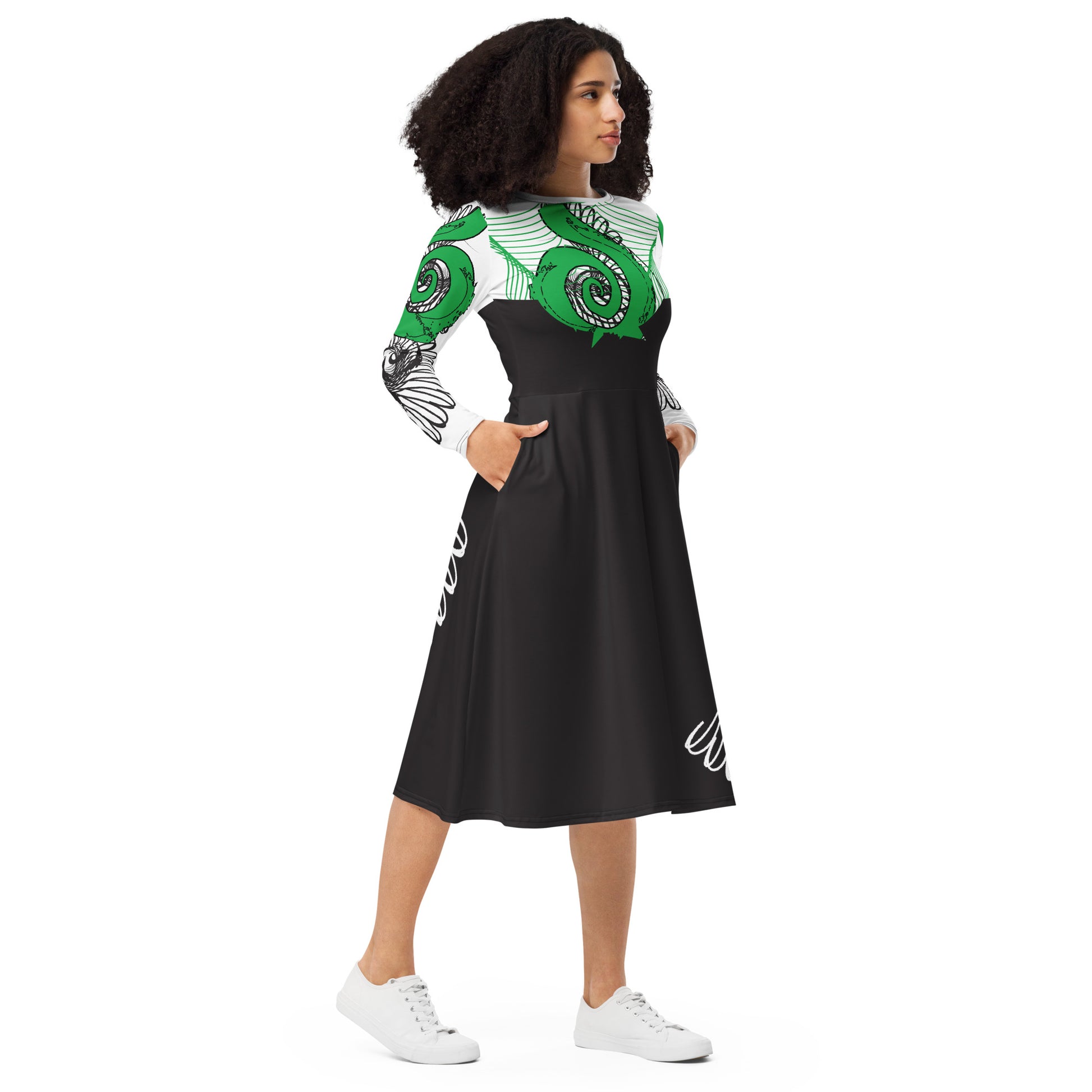 Hand-illustrated long-sleeve midi dress featuring bold green spirals, a drawing of two mirrored faces, and dynamic wing-inspired linework — designed for authentic self-expression and rooted in global artistic influence, exclusive to KLOE.