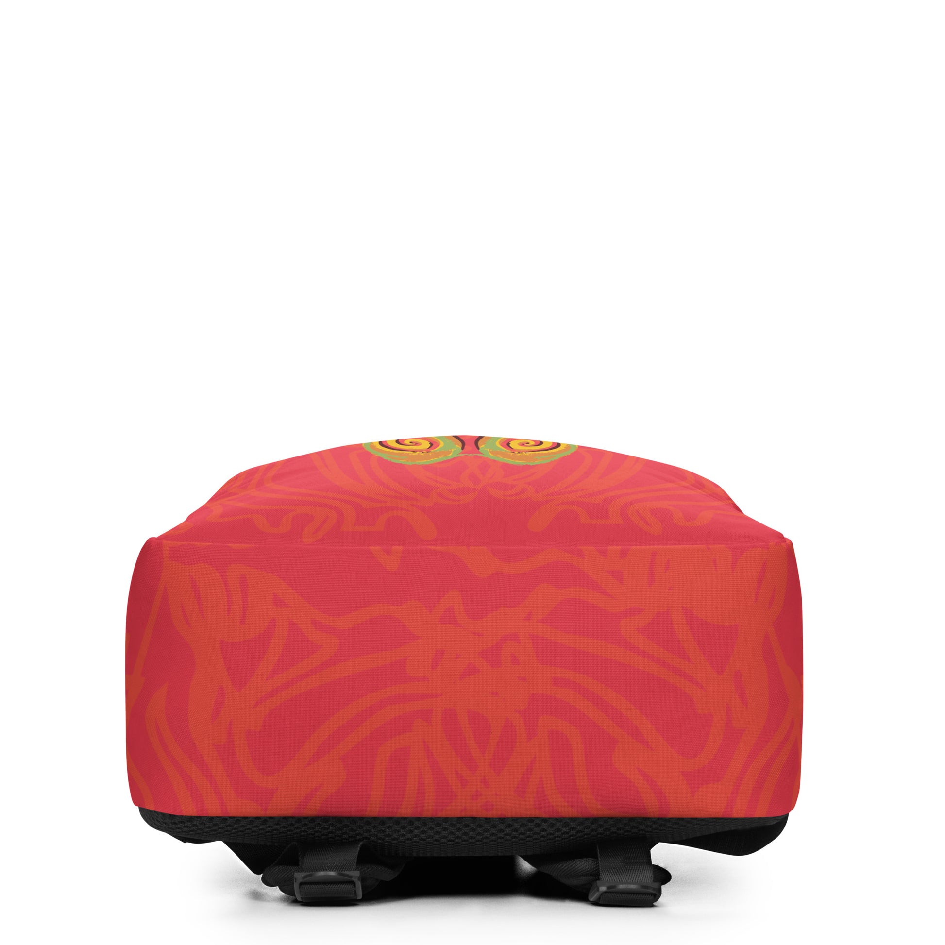 Red-orange backpack with mirrored face design and vibrant spiral patterns, inspired by cultural artistry and self-expression.
