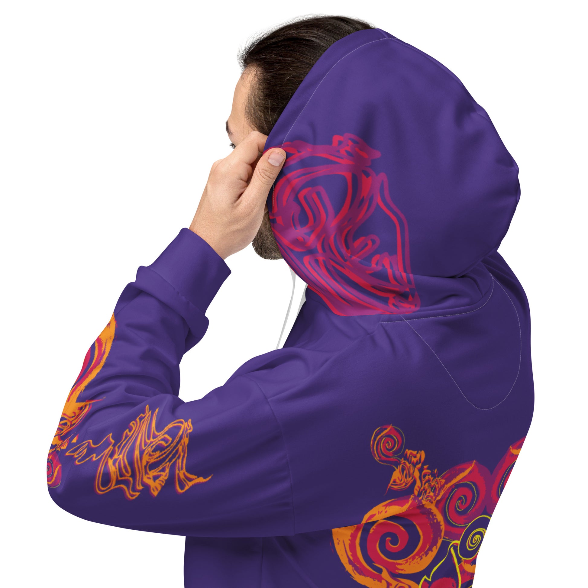 Detail view of a vibrant purple hoodie with bold orange and red culturally inspired patterns, mirrored face design, and abstract swirls — expressive fashion from KLOE’s The Secret Chambers of I & I collection.