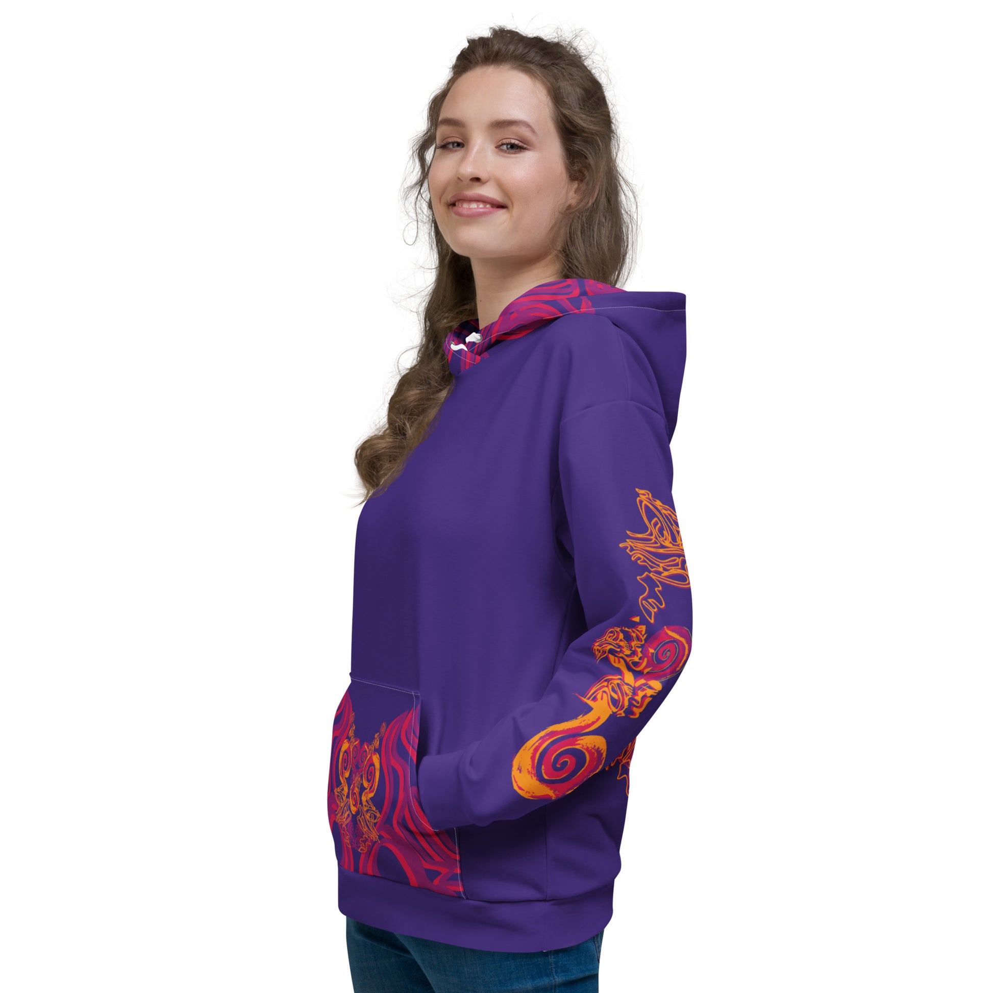 Vibrant purple hoodie with bold orange and red culturally inspired patterns, mirrored face design, and abstract swirls — expressive fashion from KLOE’s The Secret Chambers of I & I collection, on a model.