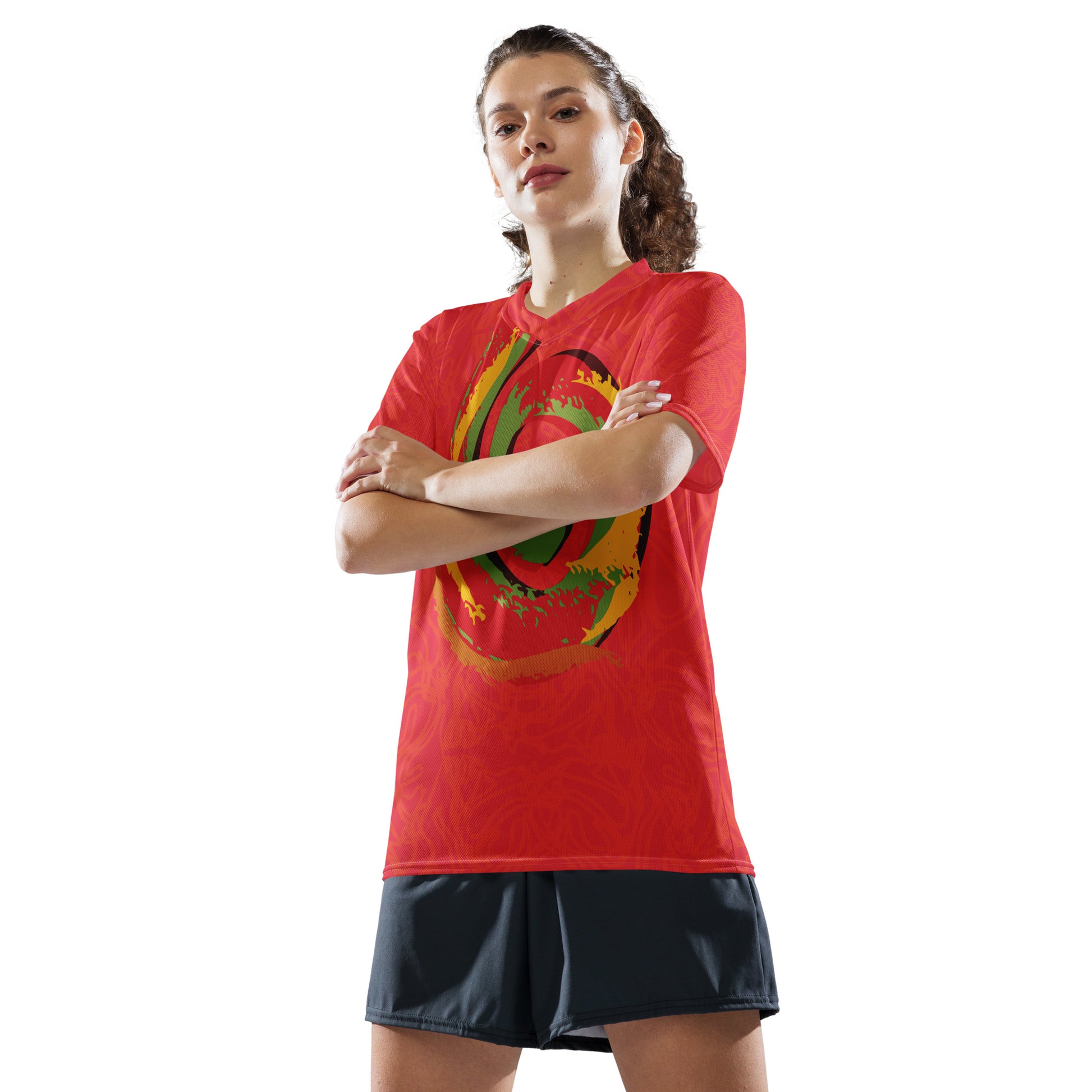 Red sports jersey with bold swirl on the front and mirrored face design on the back, inspired by cultural art and self-expression.