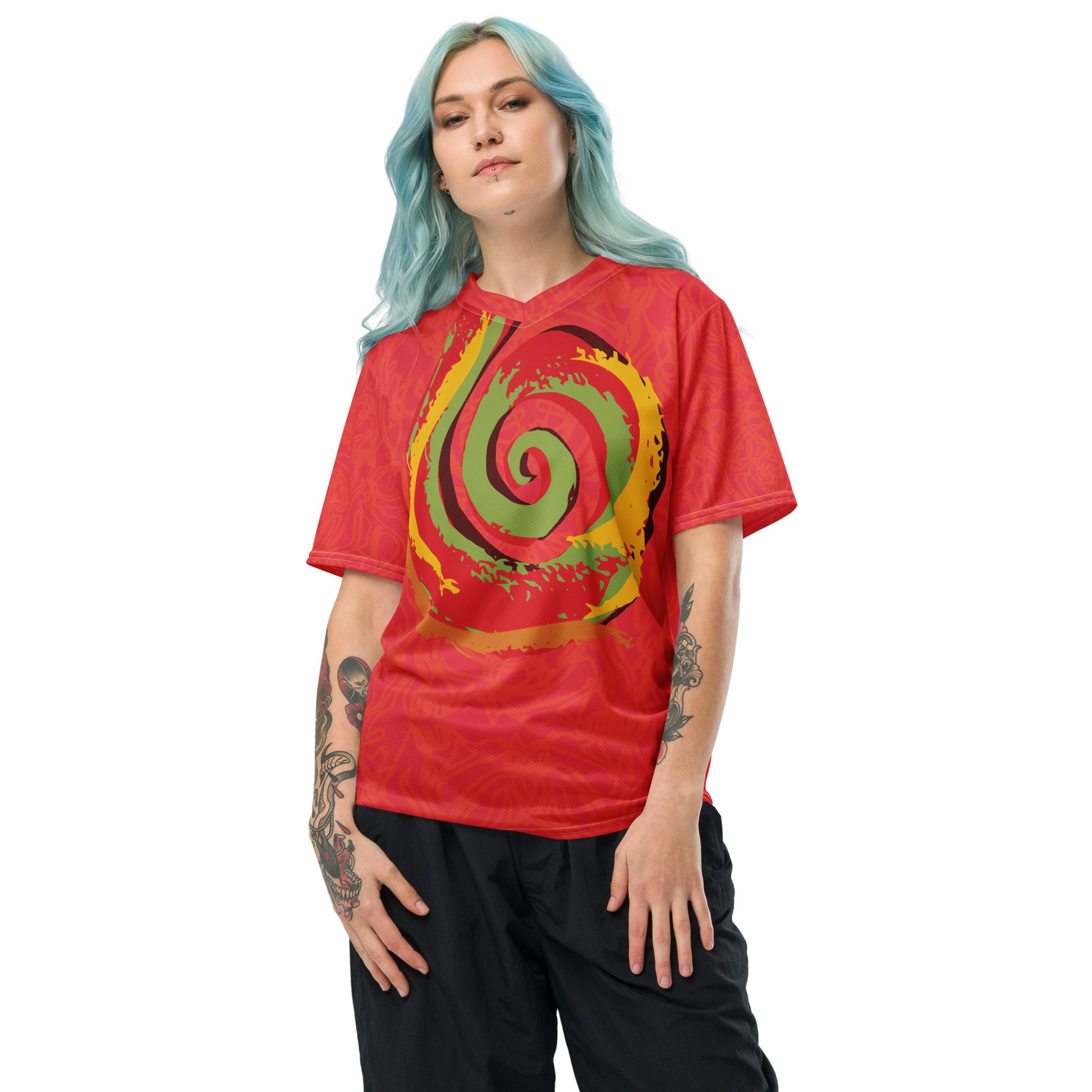 Red sports jersey with bold swirl on the front and mirrored face design on the back, inspired by cultural art and self-expression.
