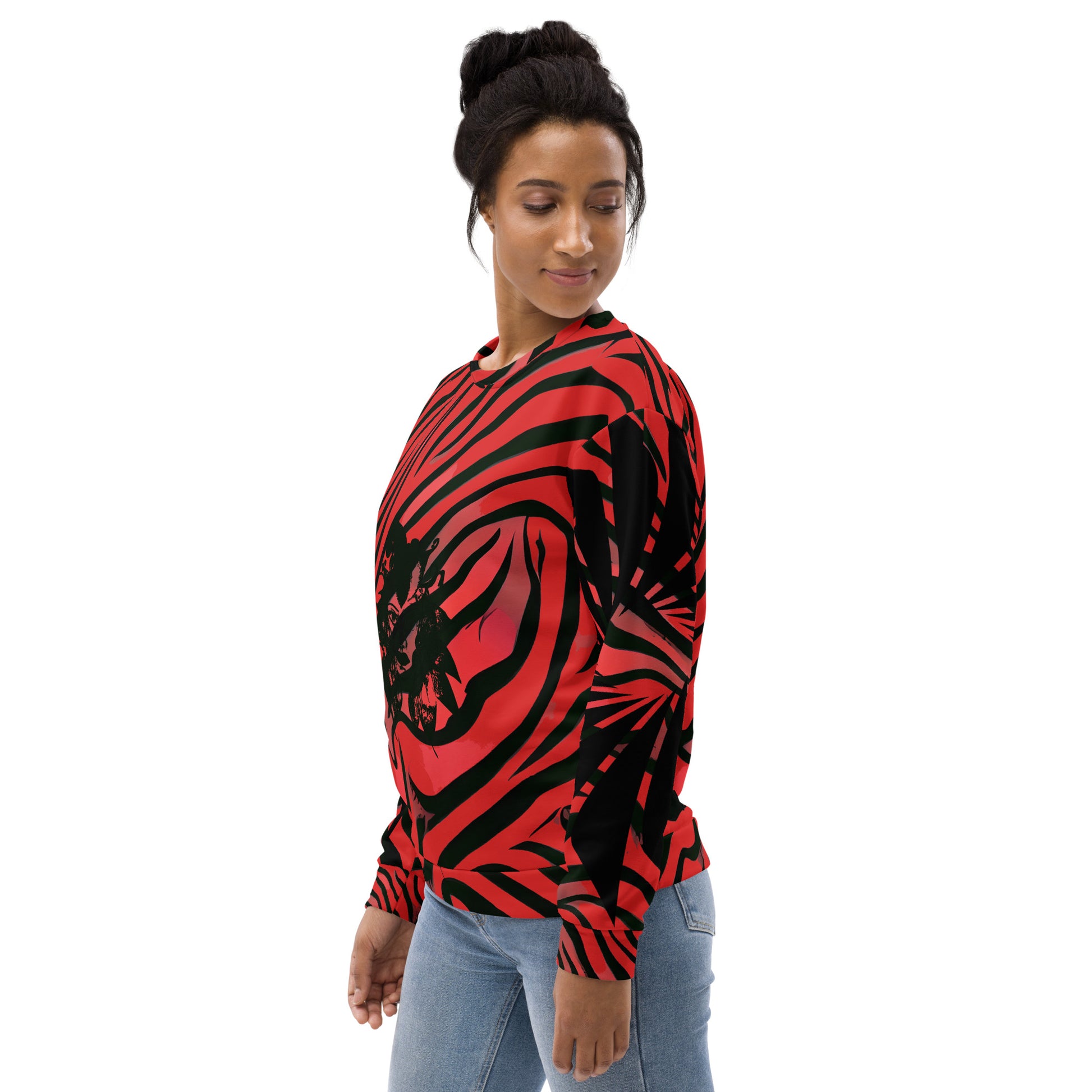 Front side view of a model wearing a bold red and black unisex sweatshirt from Kloe Store featuring a striking artistic face design, showcasing unique streetwear style with a vibrant, swirling pattern.