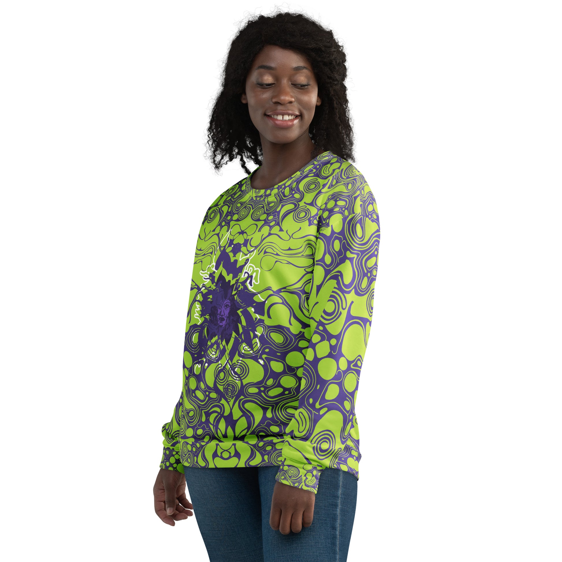 A model wearing green and purple unisex sweatshirt from Kloe Store featuring bold abstract patterns and a central artistic face design on both front and back, perfect for an edgy and modern streetwear style.