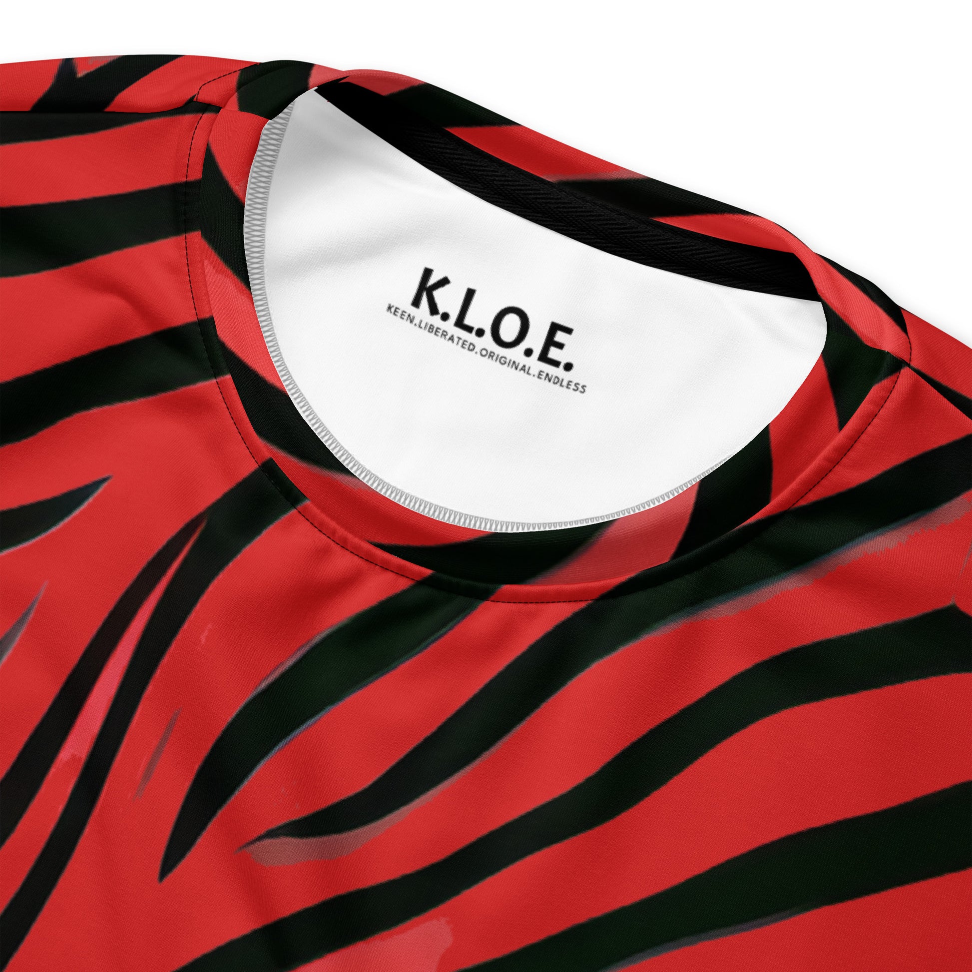 Product detail view of a bold red and black unisex sweatshirt from Kloe Store featuring a striking artistic face design, showcasing unique streetwear style with a vibrant, swirling pattern.