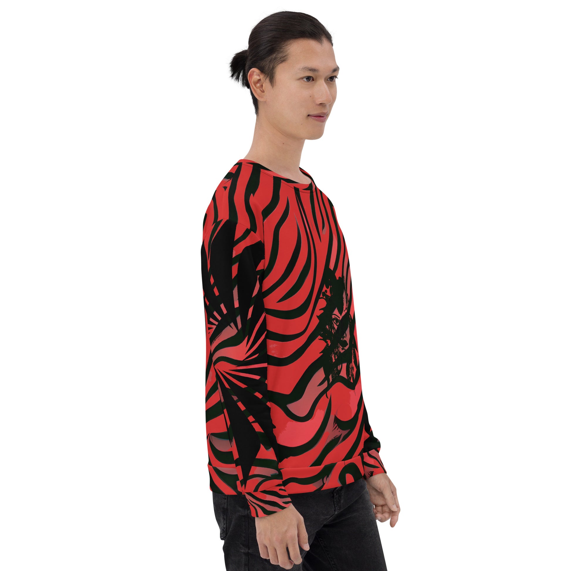 Side view of a model wearing a bold red and black unisex sweatshirt from Kloe Store featuring a striking artistic face design, showcasing unique streetwear style with a vibrant, swirling pattern.