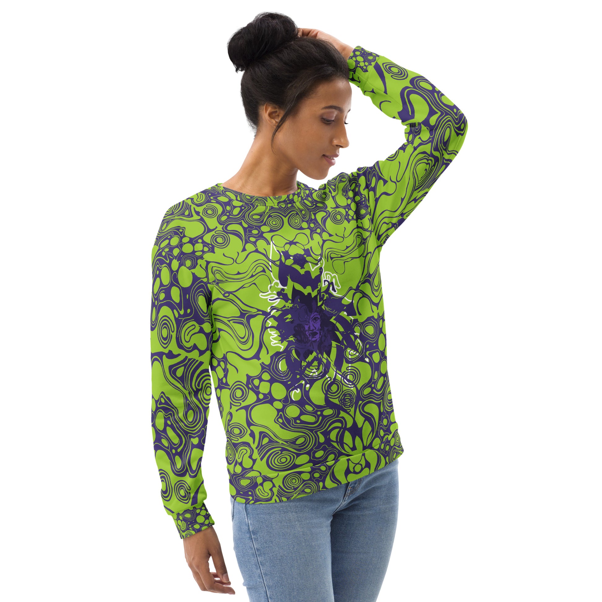 A model wearing green and purple unisex sweatshirt from Kloe Store featuring bold abstract patterns and a central artistic face design on both front and back, perfect for an edgy and modern streetwear style.