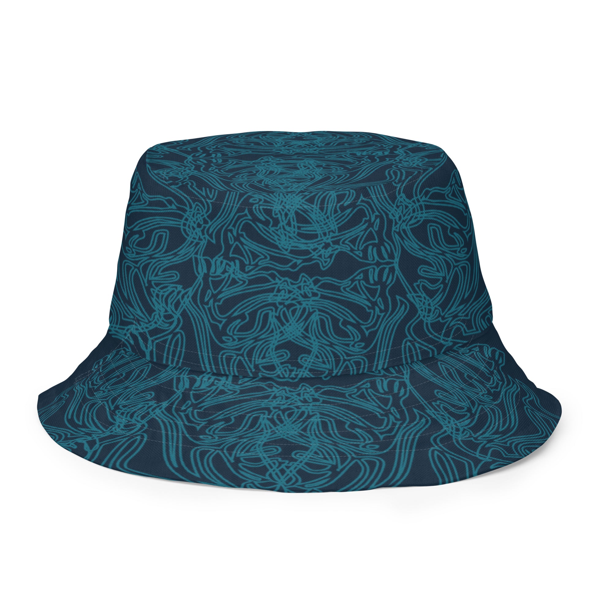 Reversible bucket hat with a navy blue base and intricate cyan linework, featuring an abstract, artistic pattern, worn by a model.