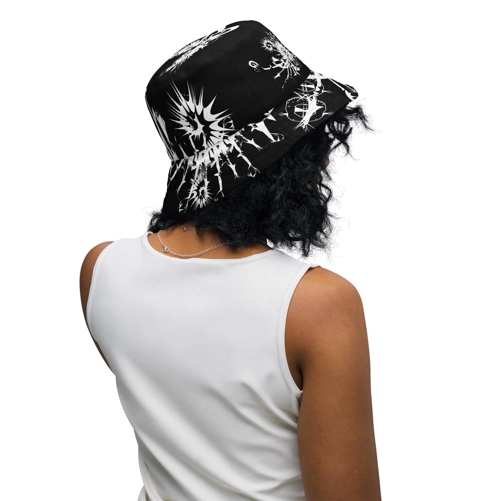 All-over print reversible bucket hat by K.L.O.E featuring white hand-drawn, culturally inspired artwork on a black background—symbolizing duality, individuality, and artistic transformation through abstract design.
