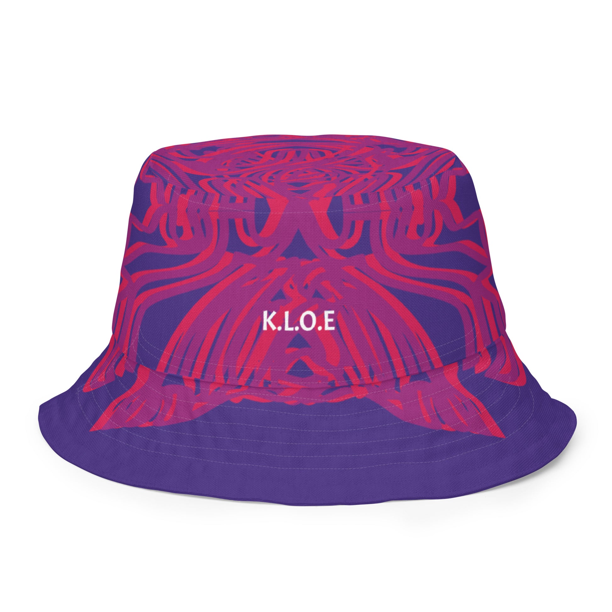 Reversible purple bucket hat with bold orange and red culturally inspired patterns, featuring abstract swirls and mirrored face design — artistic fashion accessory from KLOE’s The Secret Chambers of I & I collection.
