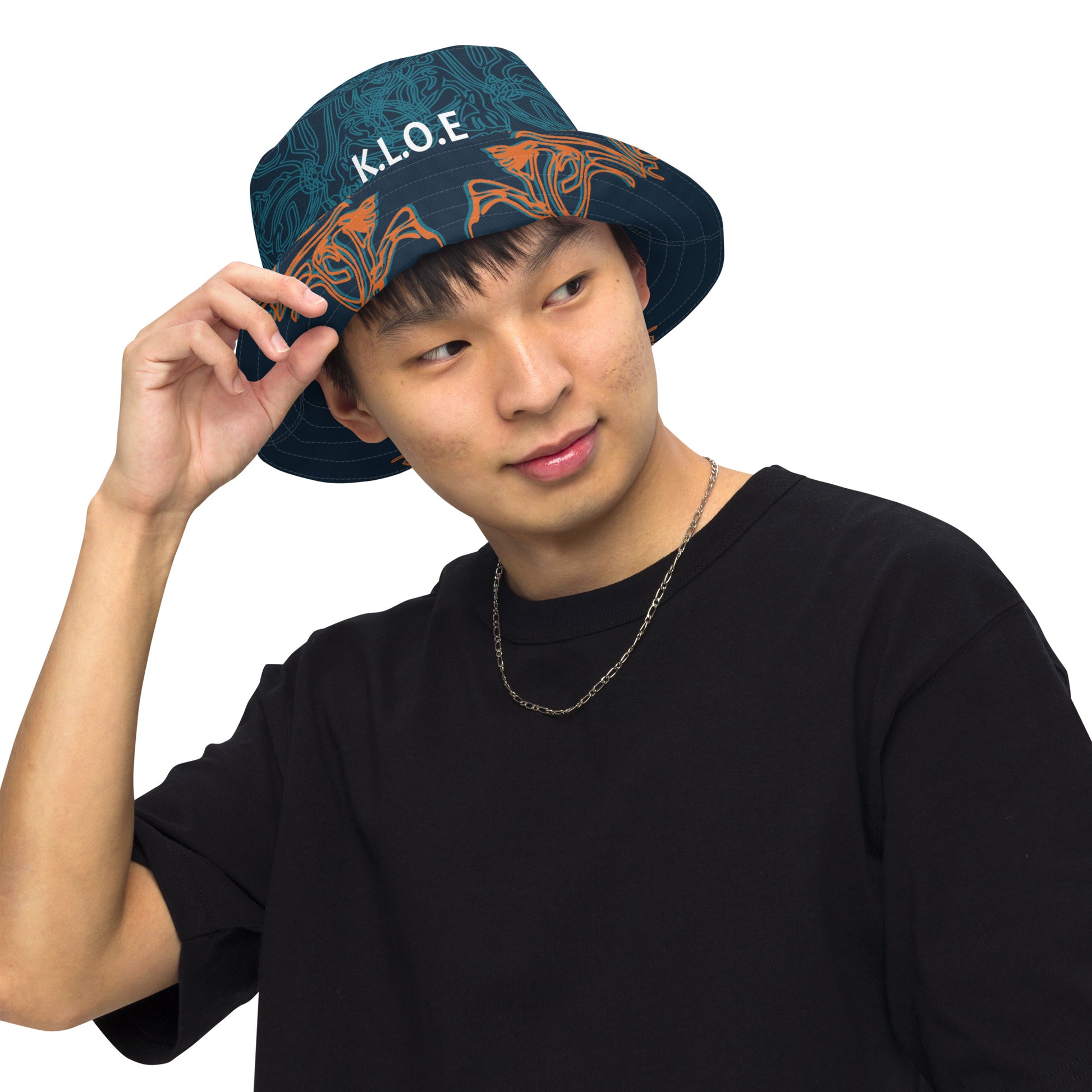 Navy blue bucket hat with cyan line art and 'K.L.O.E' branding on the front, offering a minimal yet artistic aesthetic, worn by a model.