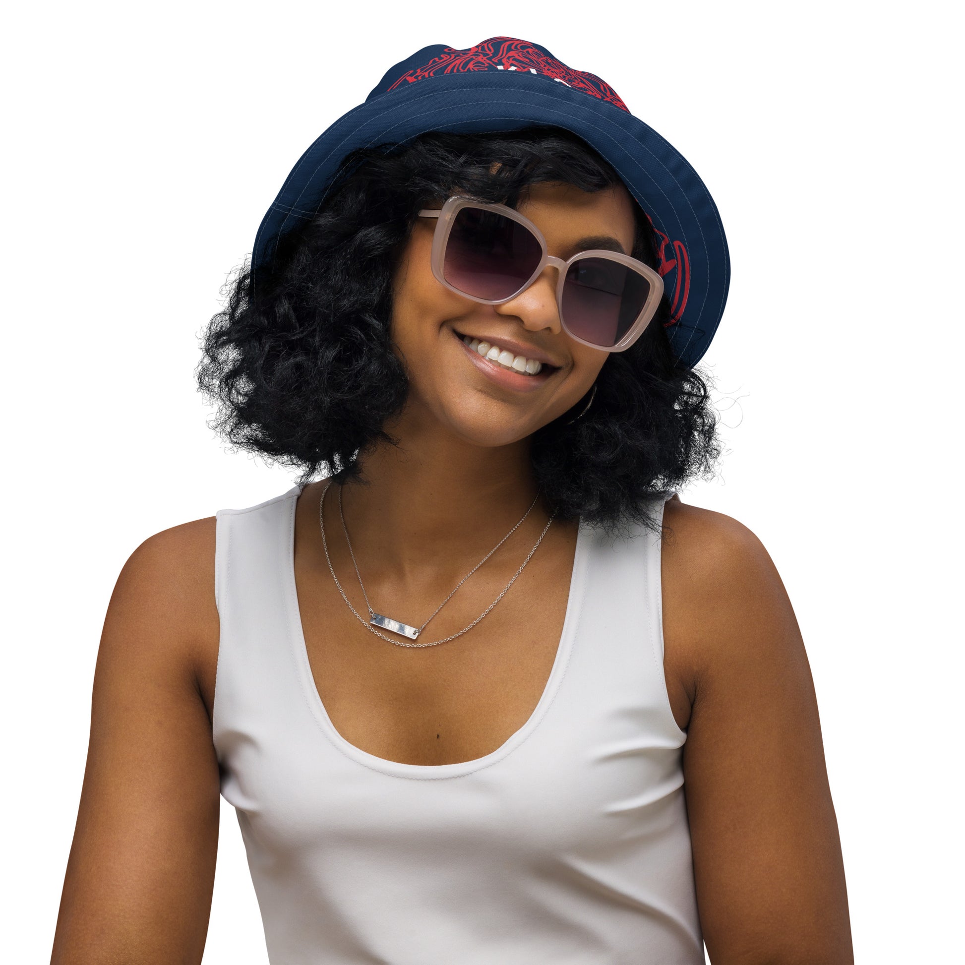 Bold reversible streetwear bucket hat featuring hand-drawn tribal patterns on one side and a mirrored face design on the other, crafted in navy and red for an edgy, modern look – KLOE fashion.