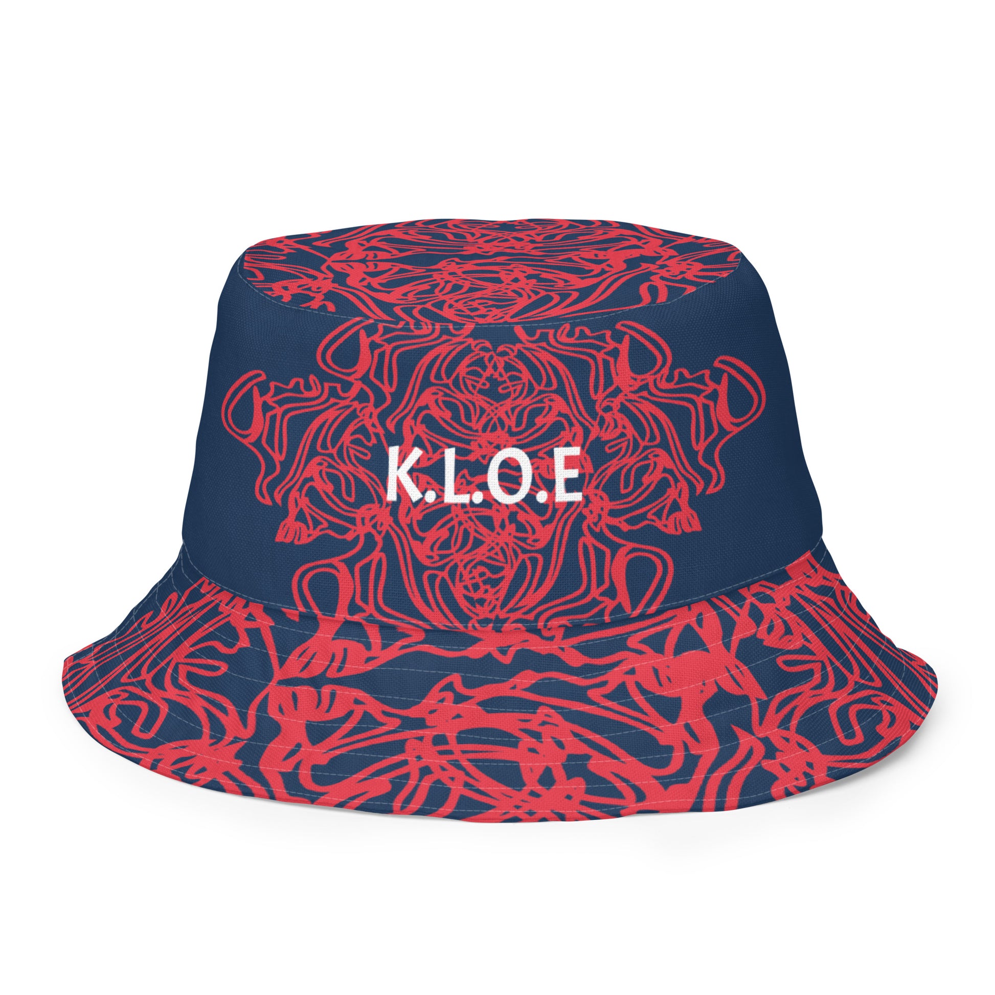 Bold reversible streetwear bucket hat featuring hand-drawn tribal patterns on one side and a mirrored face design on the other, crafted in navy and red for an edgy, modern look – KLOE fashion.