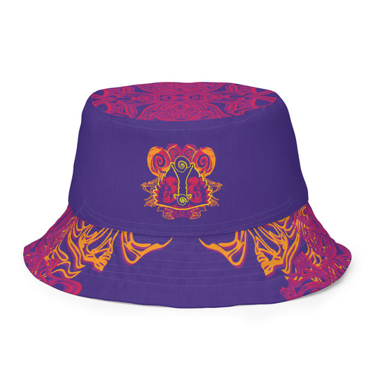 Reversible purple bucket hat with bold orange and red culturally inspired patterns, featuring abstract swirls and mirrored face design — artistic fashion accessory from KLOE’s The Secret Chambers of I & I collection.