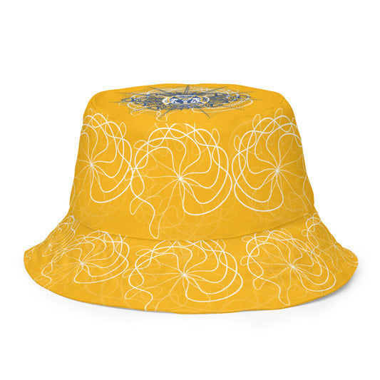 Reversible bucket hat featuring navy and golden yellow sides with abstract white linework and mirrored face emblems, blending hand-drawn cultural art with bold, expressive streetwear style.