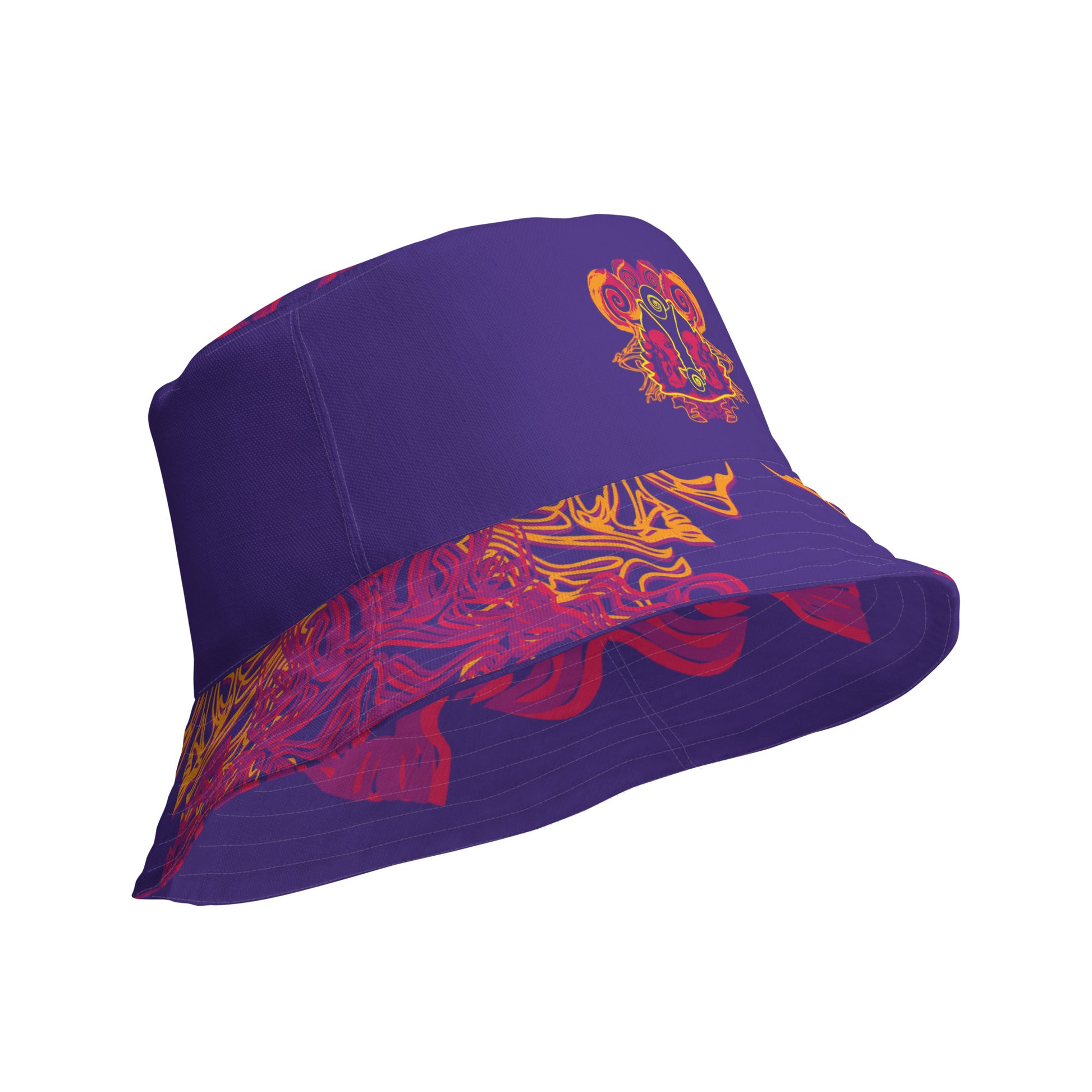 Reversible purple bucket hat with bold orange and red culturally inspired patterns, featuring abstract swirls and mirrored face design — artistic fashion accessory from KLOE’s The Secret Chambers of I & I collection.