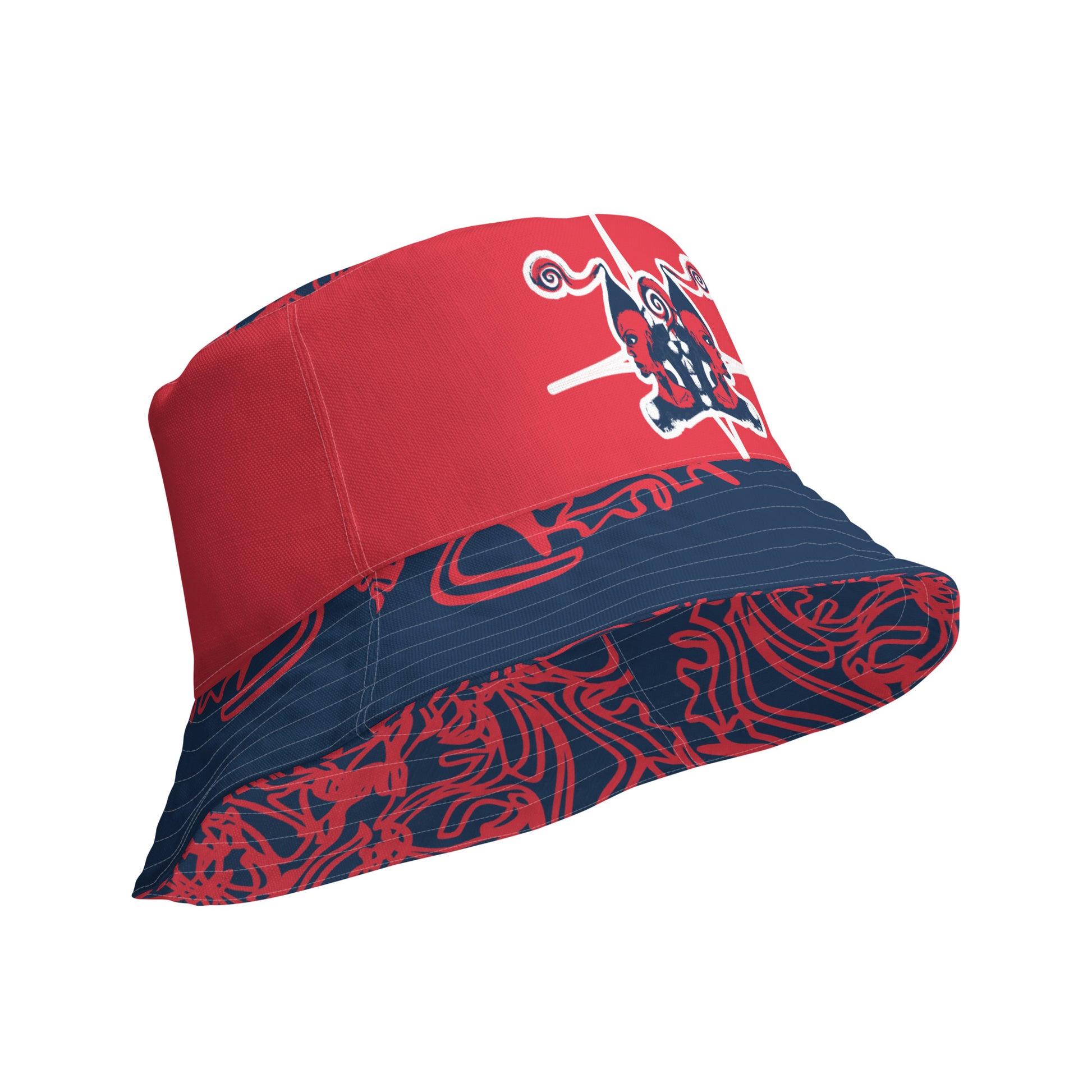 Bold reversible streetwear bucket hat featuring hand-drawn tribal patterns on one side and a mirrored face design on the other, crafted in navy and red for an edgy, modern look – KLOE fashion.